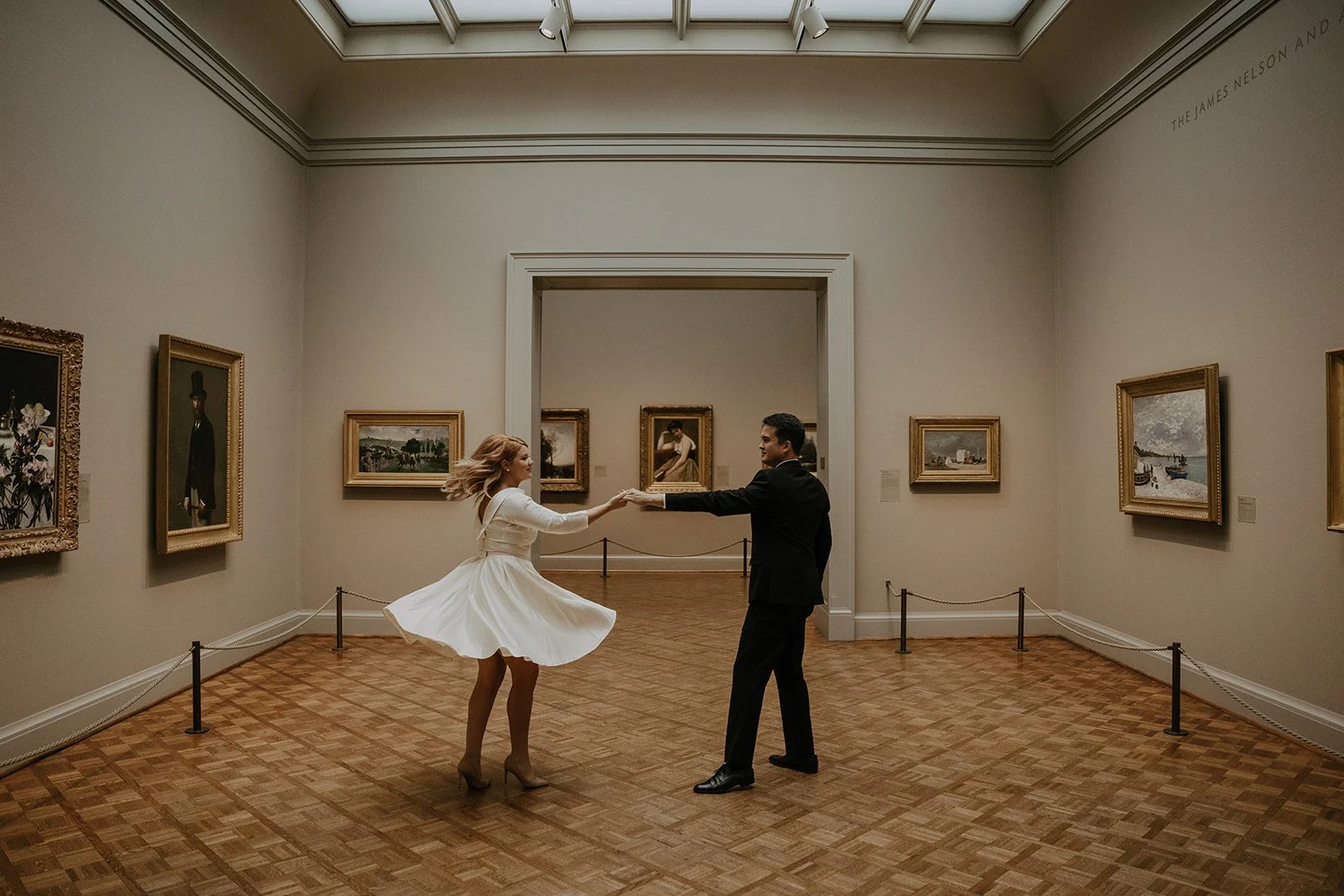 couple dancing in an art museum