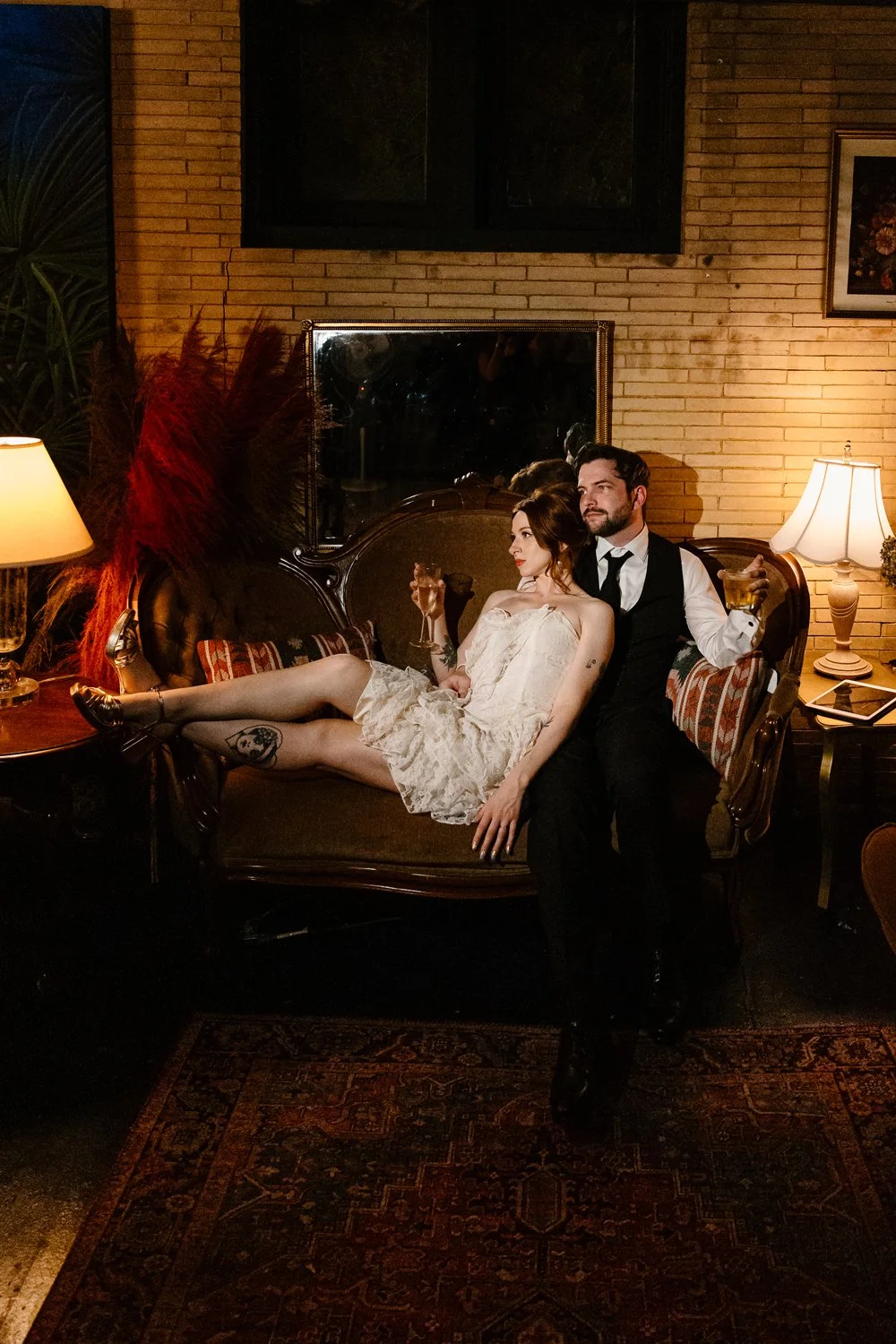 Photo of a couple lounging in a vintage-style room