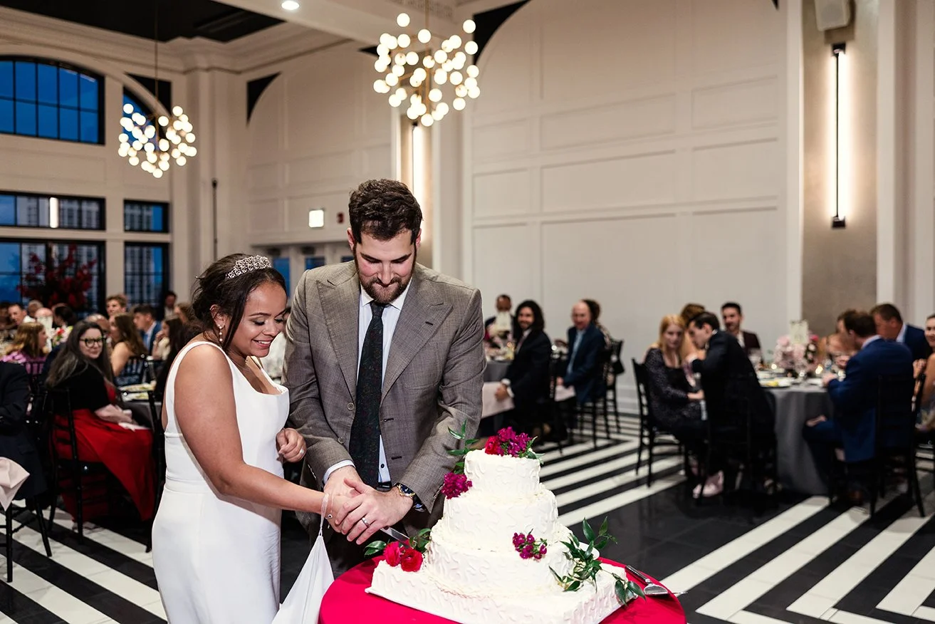photo of bride and groom cutting wedding cake