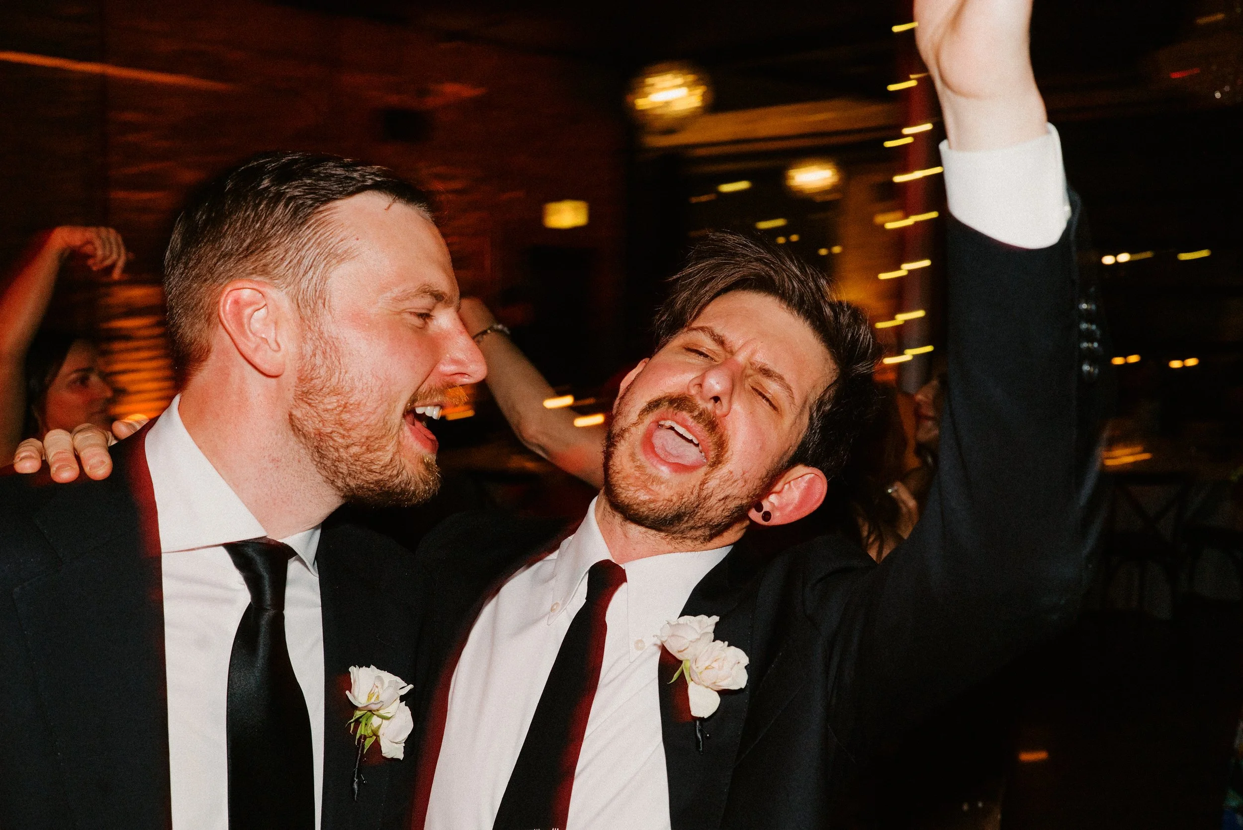 Two grooms sing together