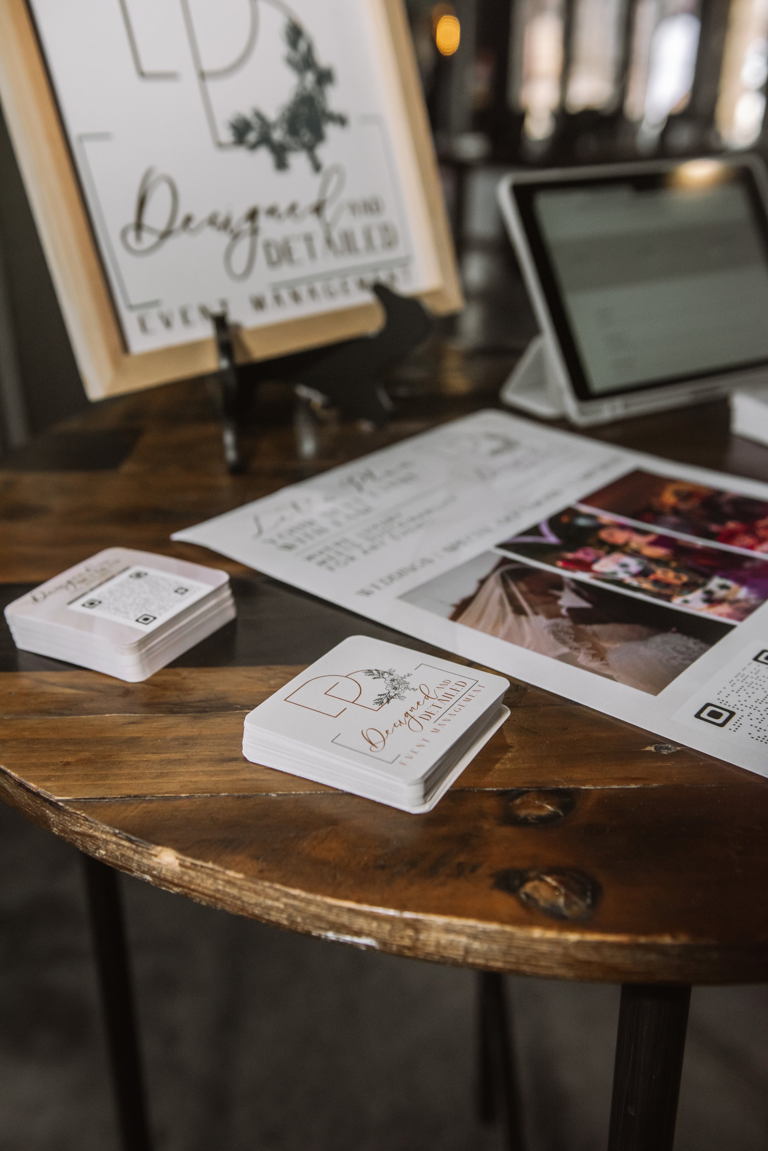 A close up of marketing materials by Designed & Detailed, a sustainable event planner