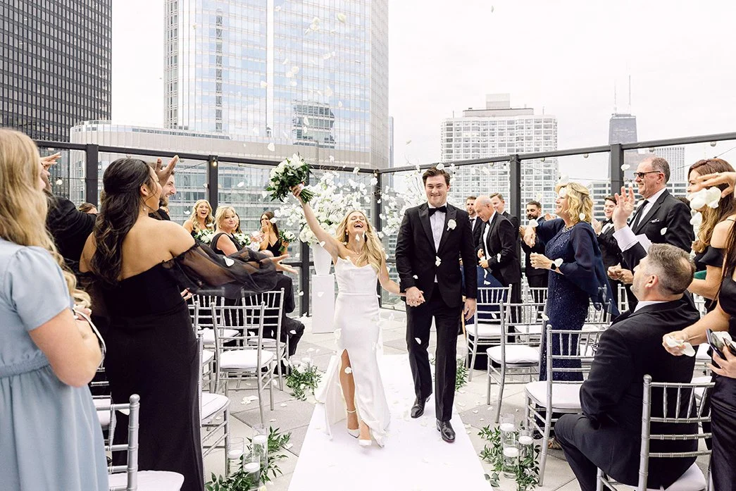 photo of bride and groom walking down the aisle