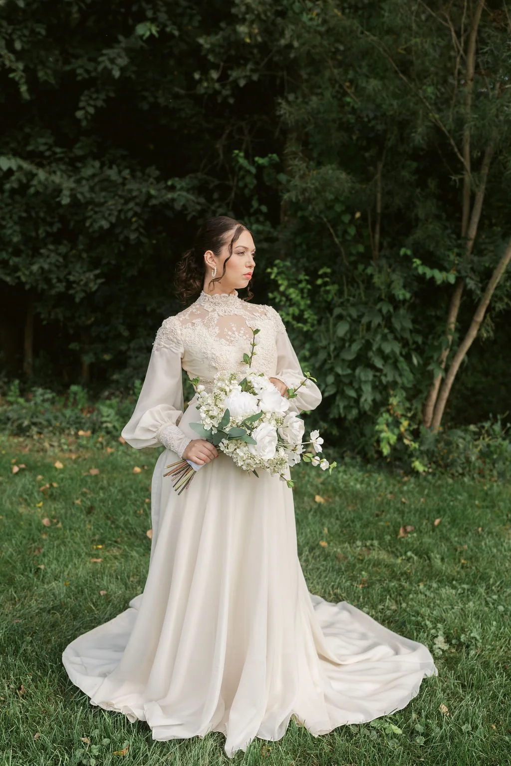 bride poses with her faux floral bouquet