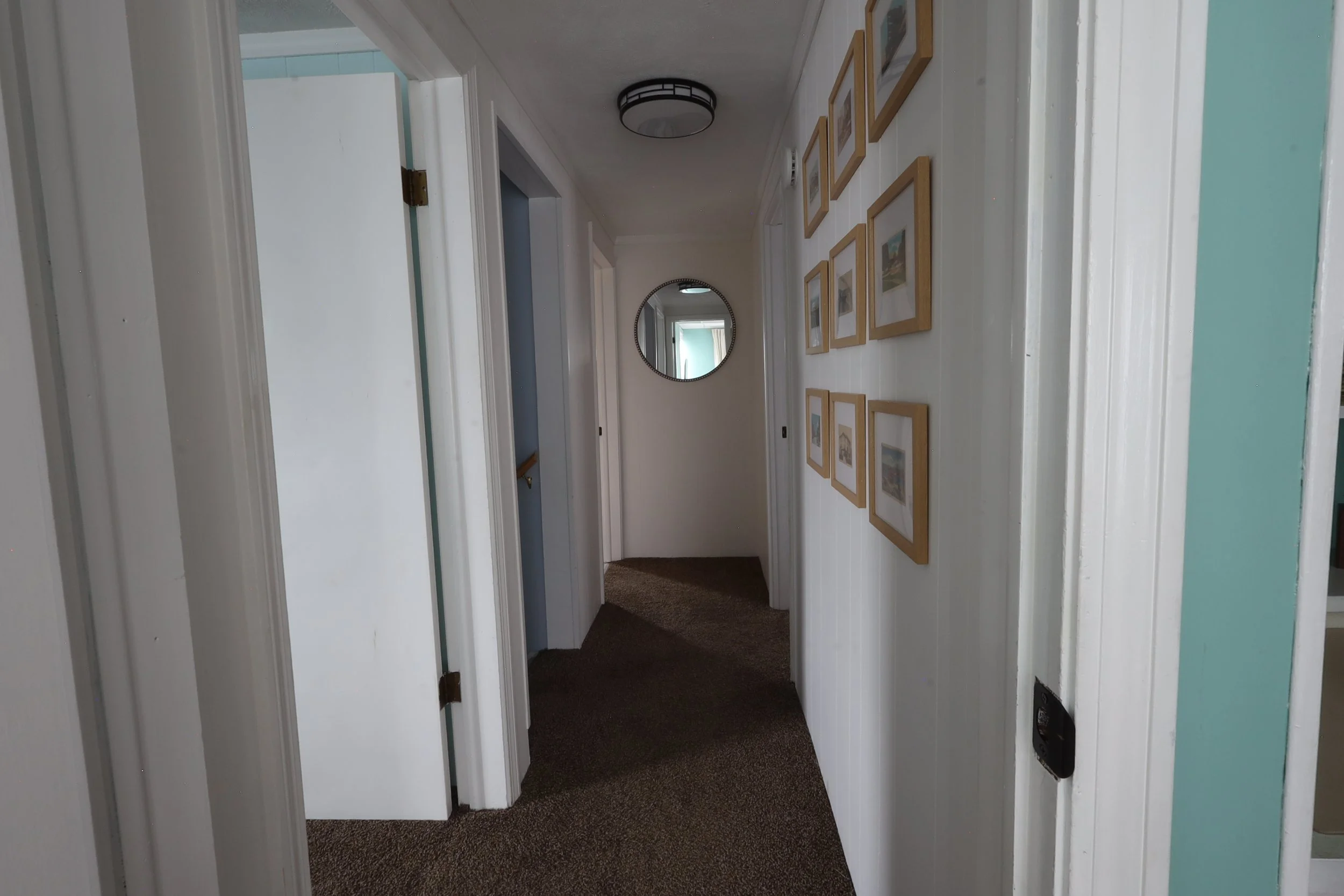 Hall between bedrooms featuring vintage Conneaut post cards