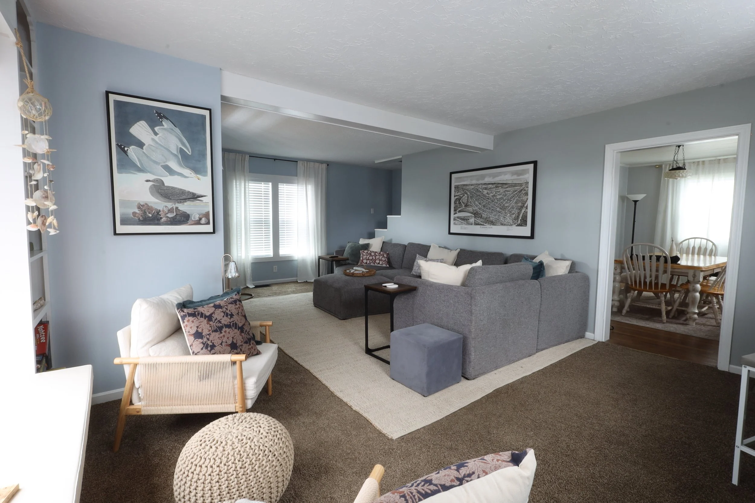 Living room with extra large couch + 2 extra sitting areas