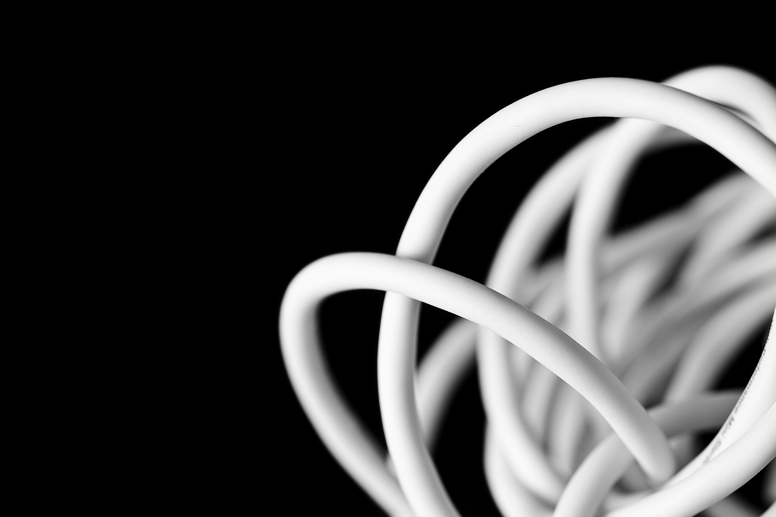 white cord with a black background