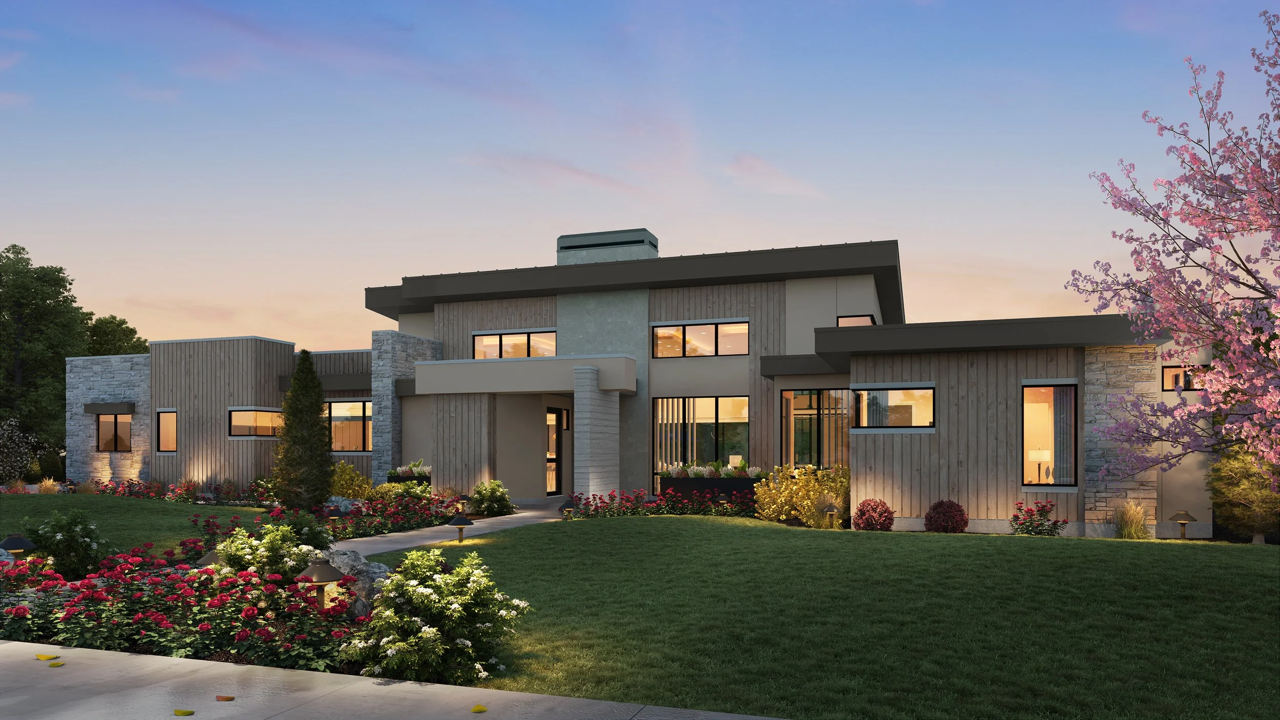 Modern house with large windows, surrounded by a well-manicured lawn and colorful flower beds, at sunset.