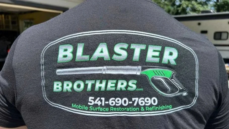 Client wearing his new company shirt showing DTF Printing