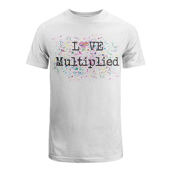 White T-shirt with multicolored paint splatter design and the text 'LOVE Multiplied' with a pink heart-shaped rainbow over the letter 'O'.