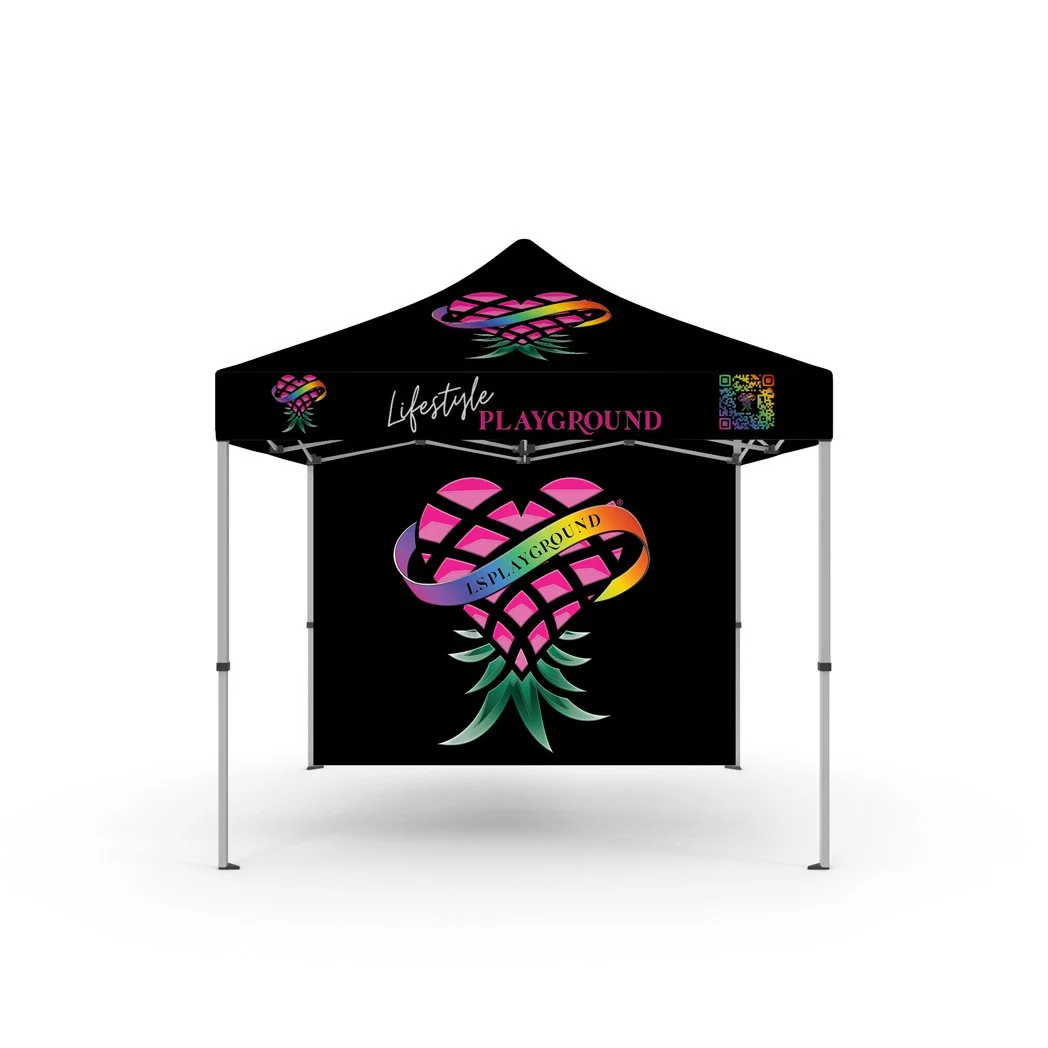Black outdoor canopy tent with colorful logo and text, promoting Lifestyle Playground, featuring a pineapple-shaped design with vibrant rainbow-colored ribbon.