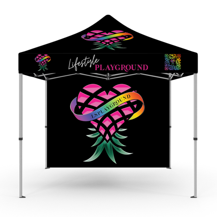 A black canopy tent decorated with colorful graphics and words related to a playground event, featuring a heart-shaped logo with the words "LIFESTYLE PLAYGROUND".