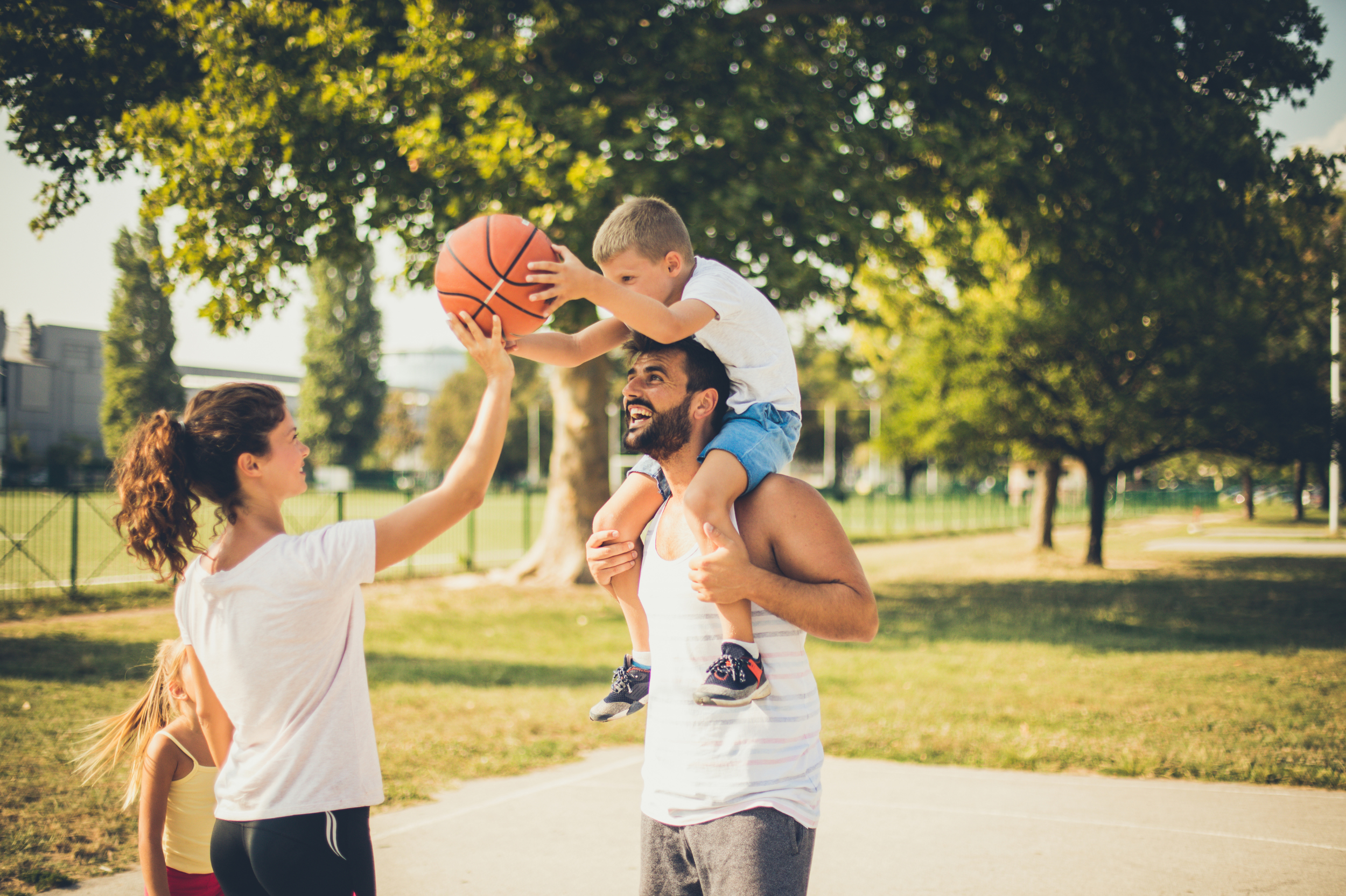 Family playing basketball