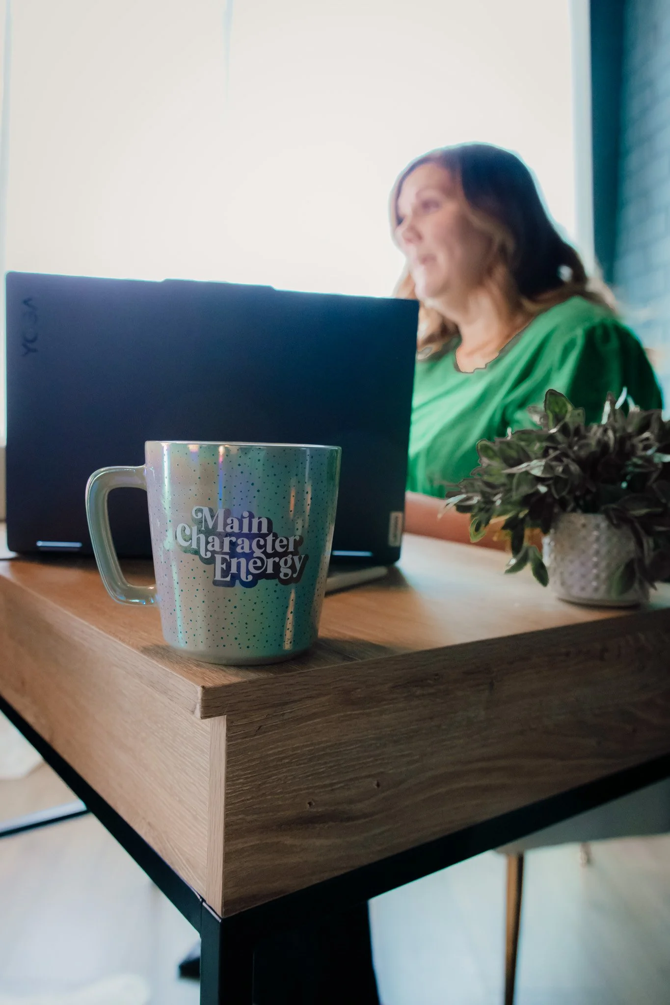 Spring TX bookkeeper working at desk with laptop providing small business bookkeeping services.