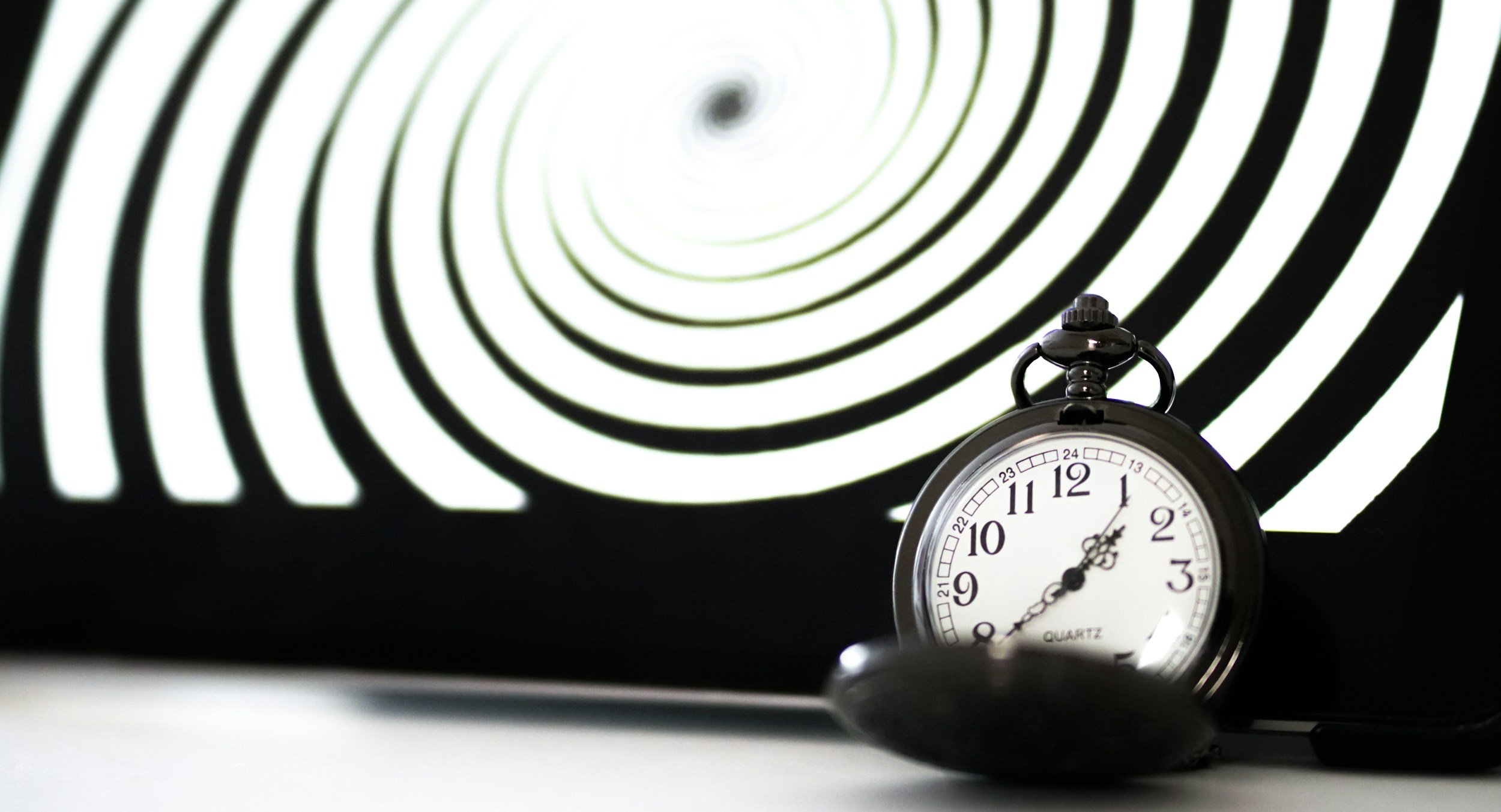 Black and white spiral with clock for hypnosis-theme