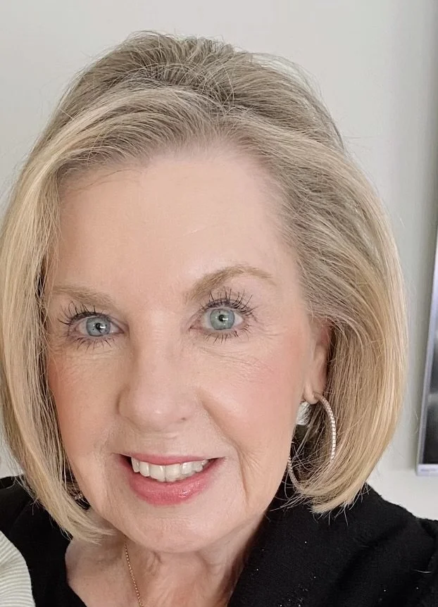 Image of a blonde woman who is an esthetician named Chris Helms smiling at the camera