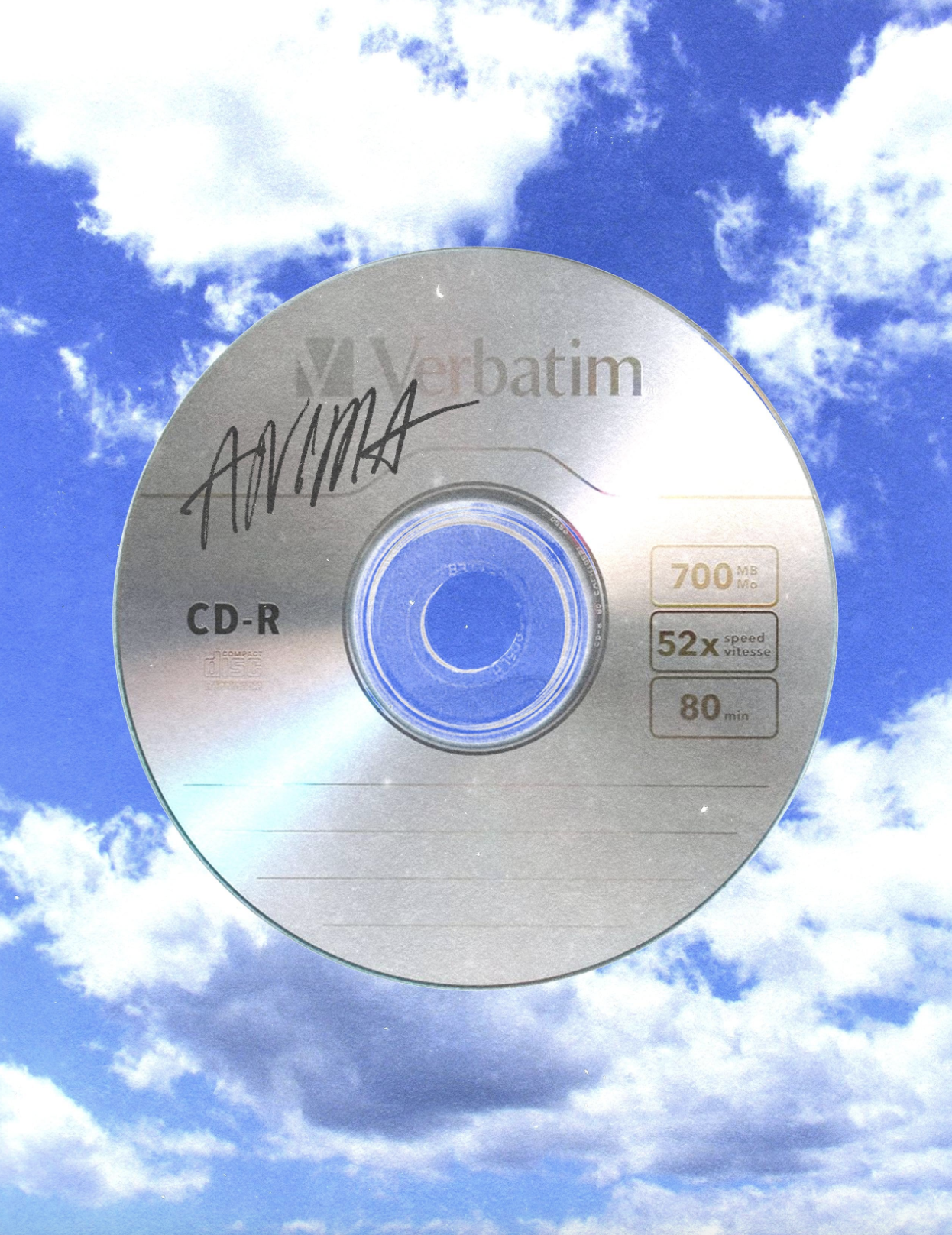 A compact disc with signatures and labels floating in the sky among clouds.