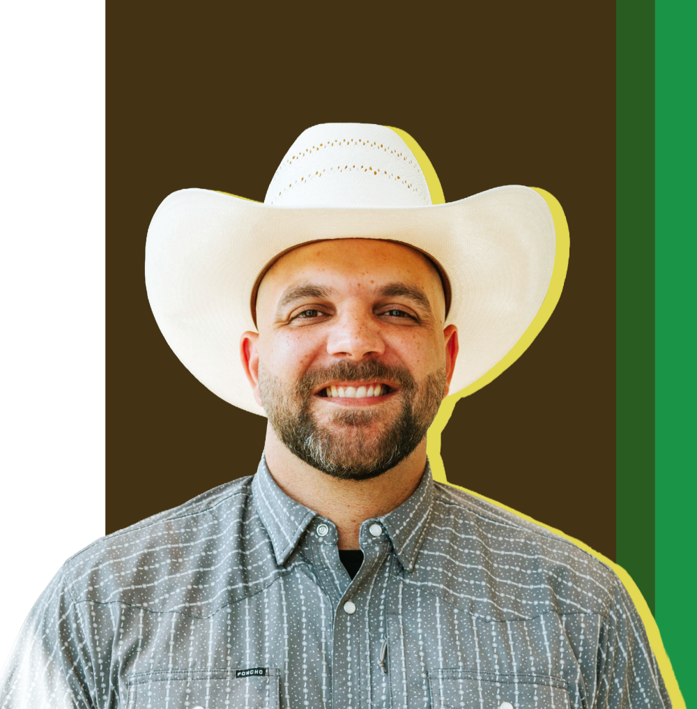 A man wearing a white cowboy hat and a gray patterned button-up shirt, smiling in front of a stylized background with dark brown, green, and yellow accents.