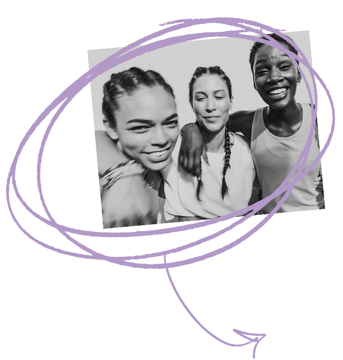 Three young women smiling and posing together for a photo.
