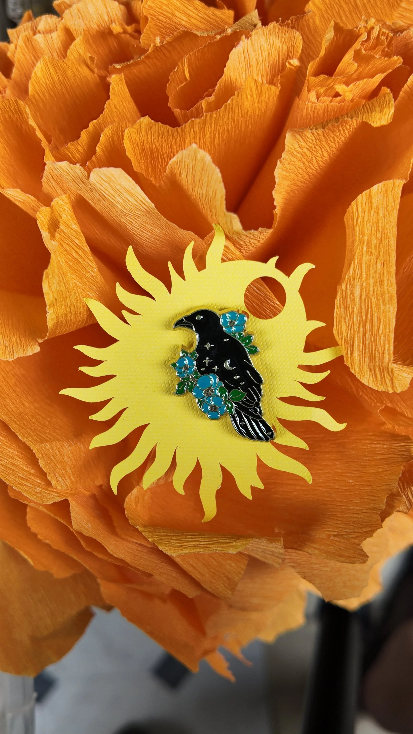 Crow with blue flower