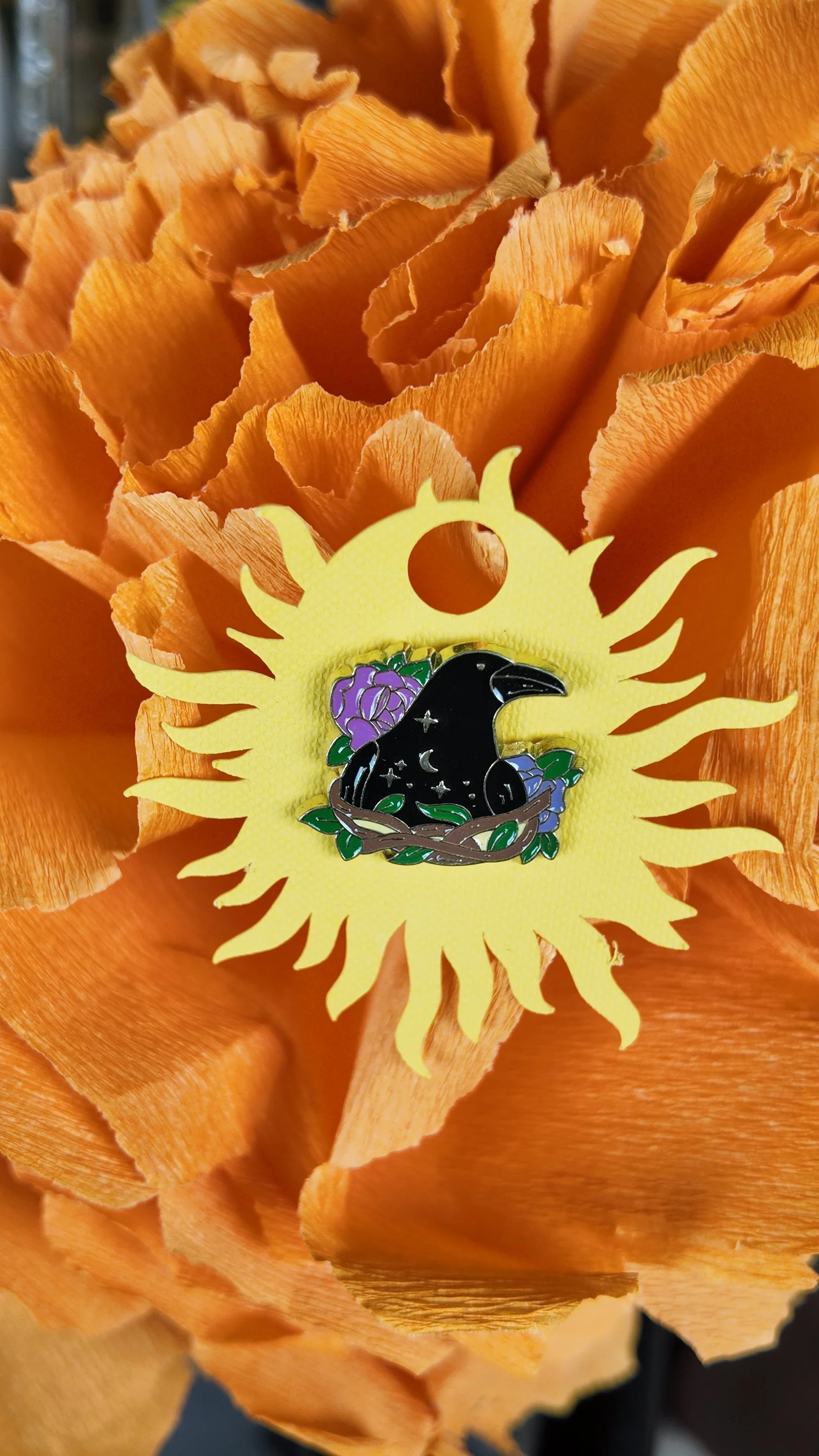 Black crow with purple flower