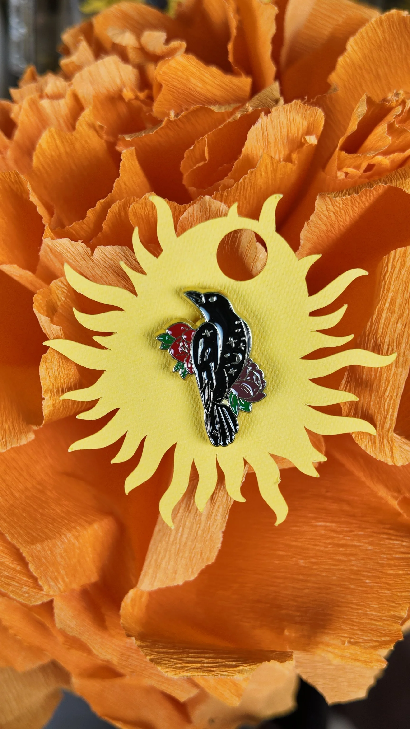 Crow with red and purple flower