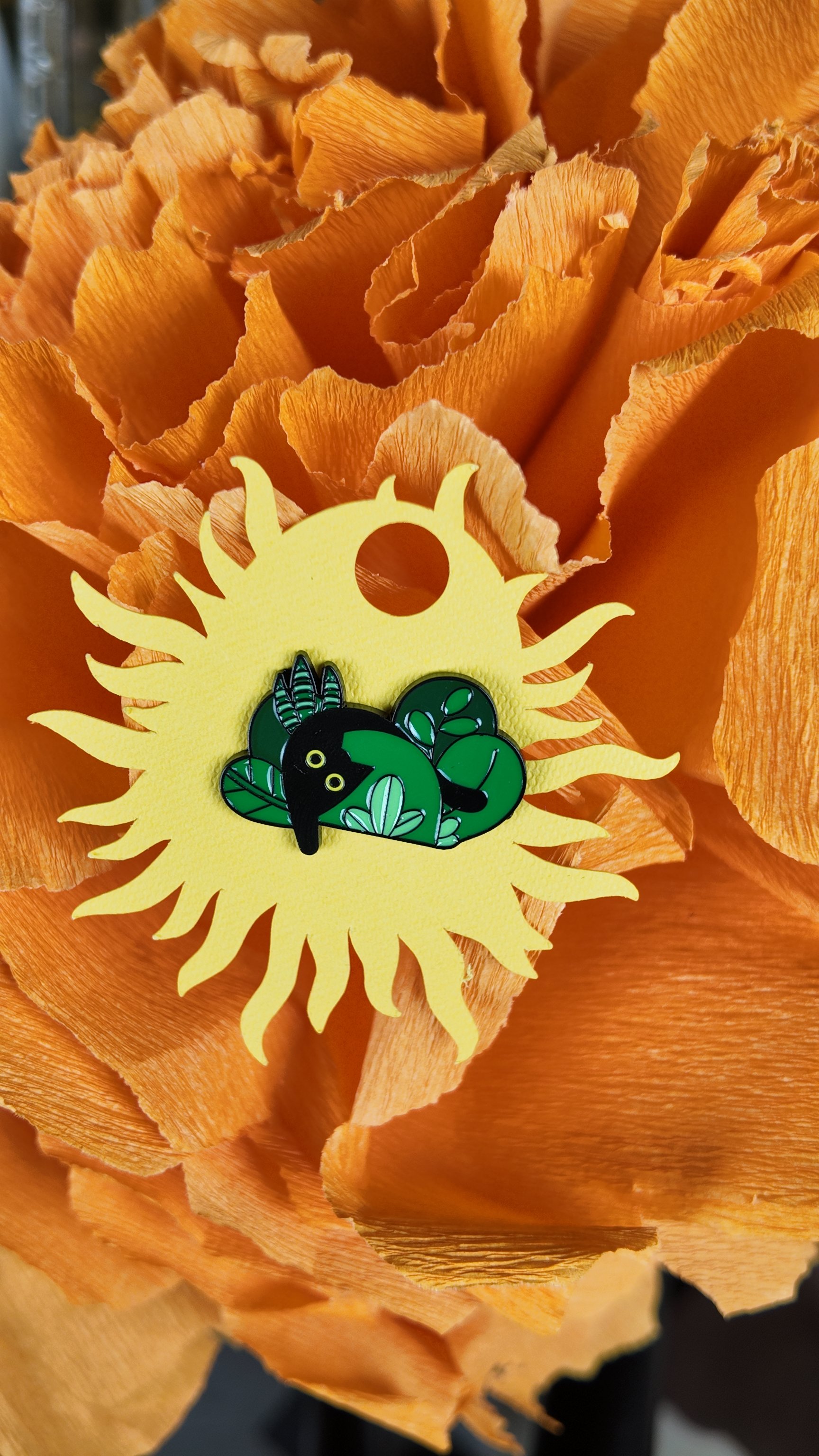 Sneaky black cat behind plants pin