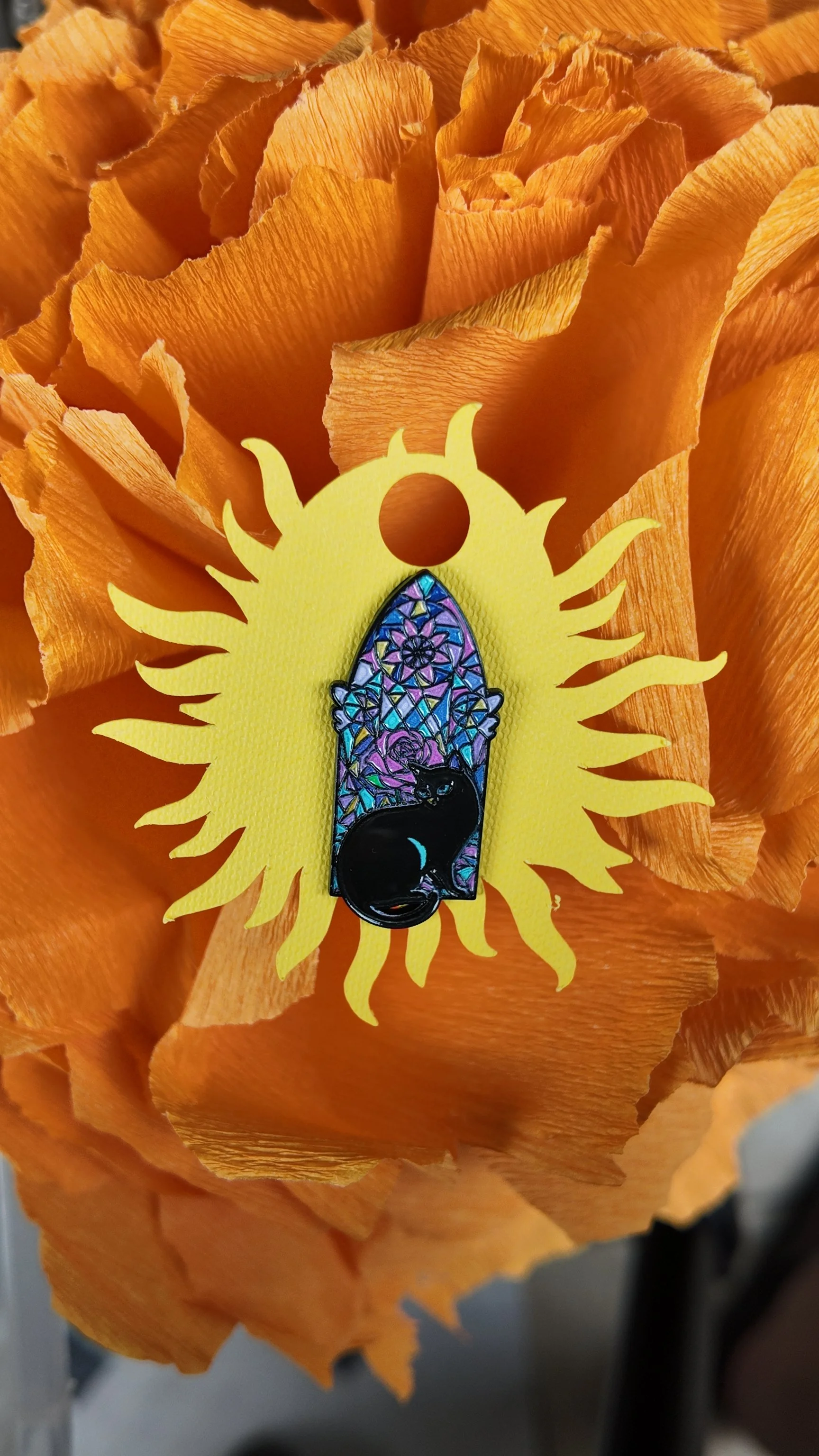 Floral mosaic with black cat