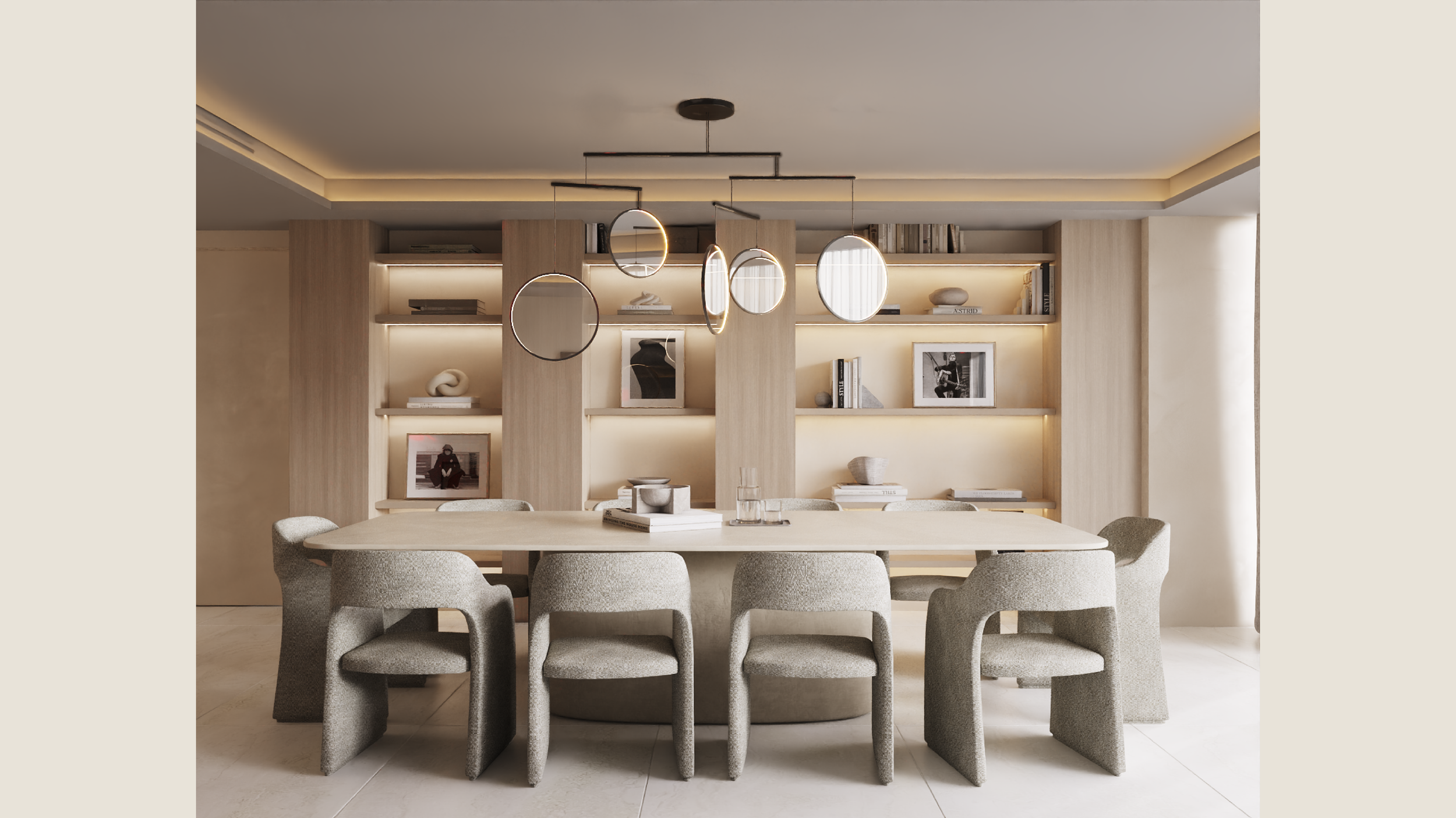 Modern dining room with a light wood oval table, surrounded by eight grey upholstered chairs. Overhead, a contemporary chandelier with circular mirrors and thin rods. In the background, a built-in wooden bookshelf with backlighting, decorated with books, framed photos, and decorative objects.