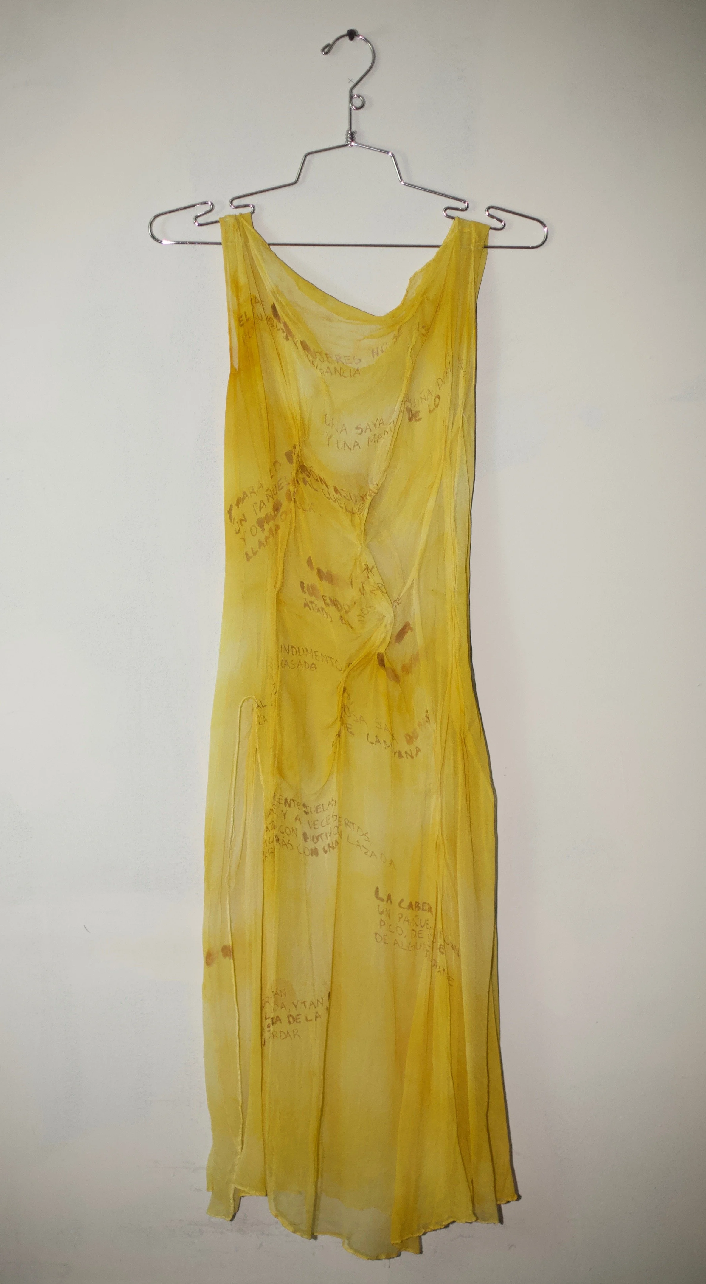 Onion skin natural dyed silk, hand sewn gathers, hand painted with vintage text from a historical Spanish clothing textbook.