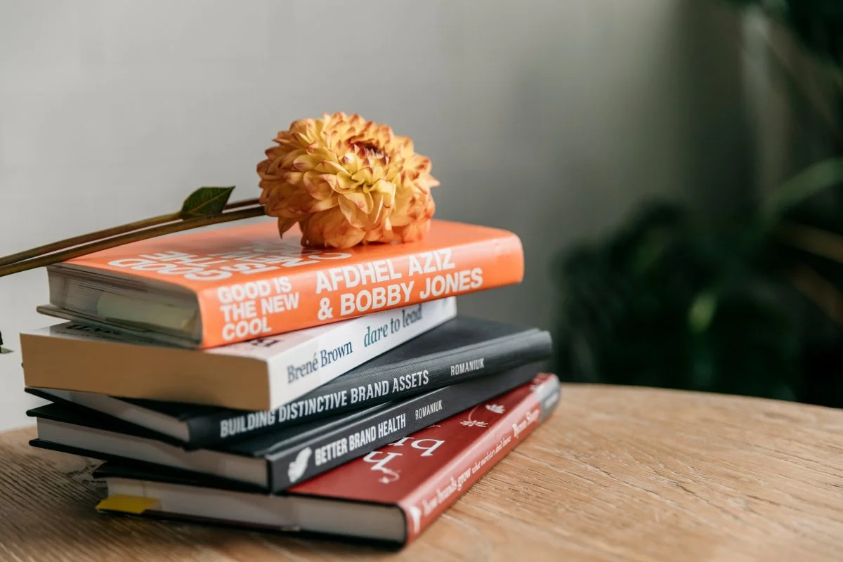 Stack of books with a flower on top