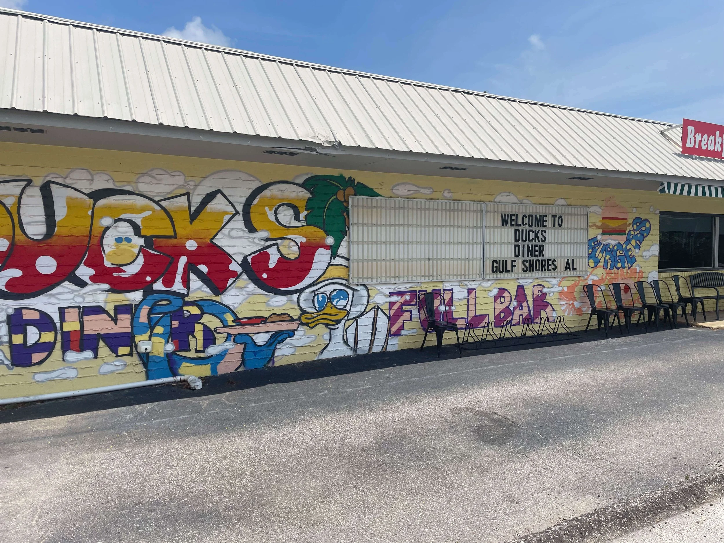 Wide view of Duck’s Diner mural featuring vibrant lettering and cartoon duck, Gulf Shores AL, 2025.