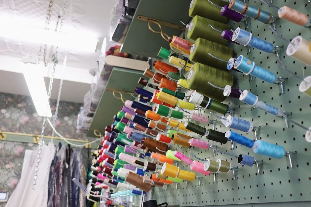Wall of colourful thread spools