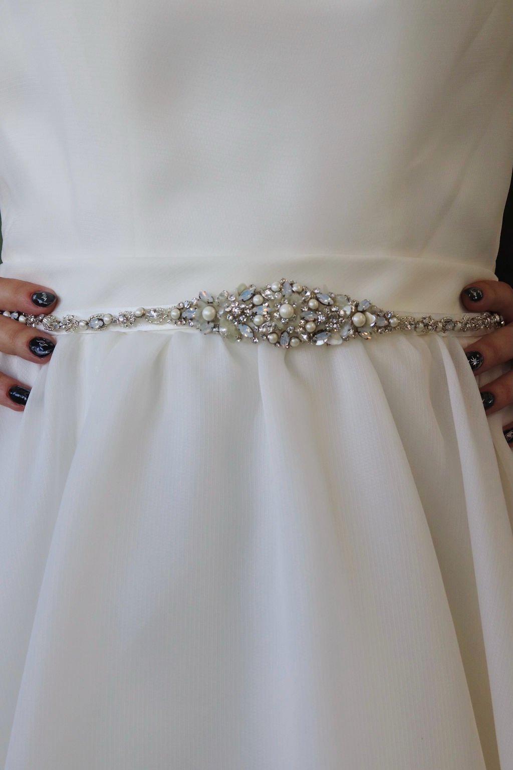 Classic A-line sample gown, pearl-and-crystal belt detail