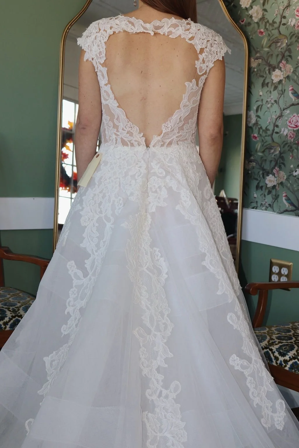 Lace sheath sample gown with tulle overskirt, back view