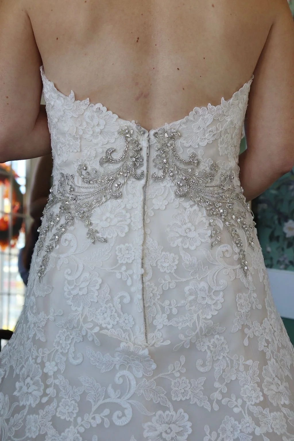 Champagne strapless ballgown sample gown, lace appliqué detail