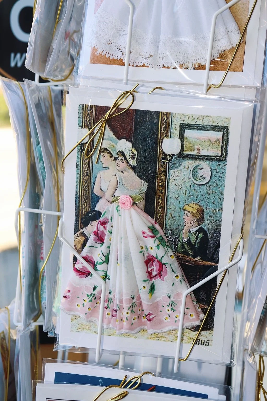 Handkerchief gift card detail with a floral dress