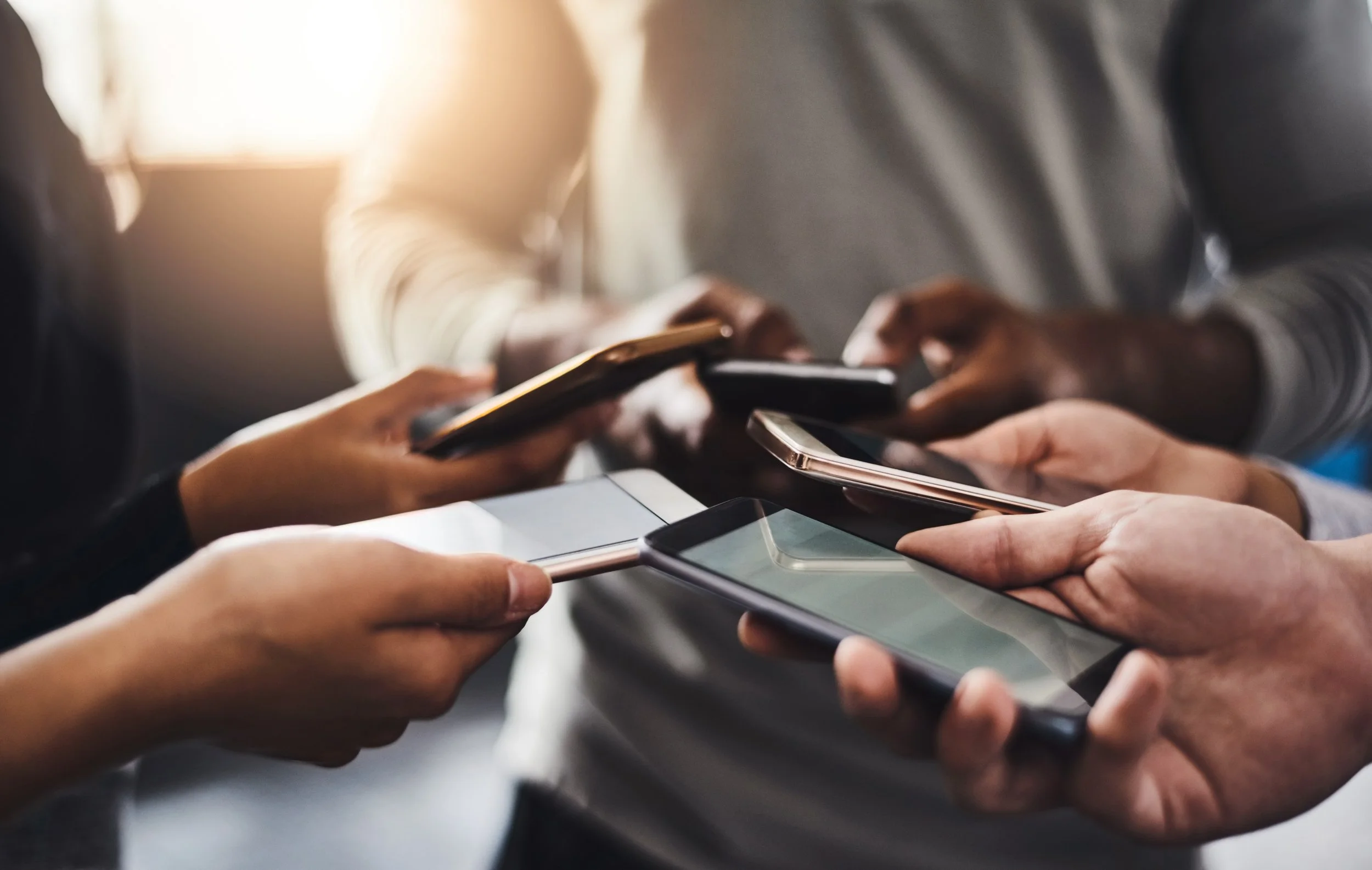 Hands holding phones