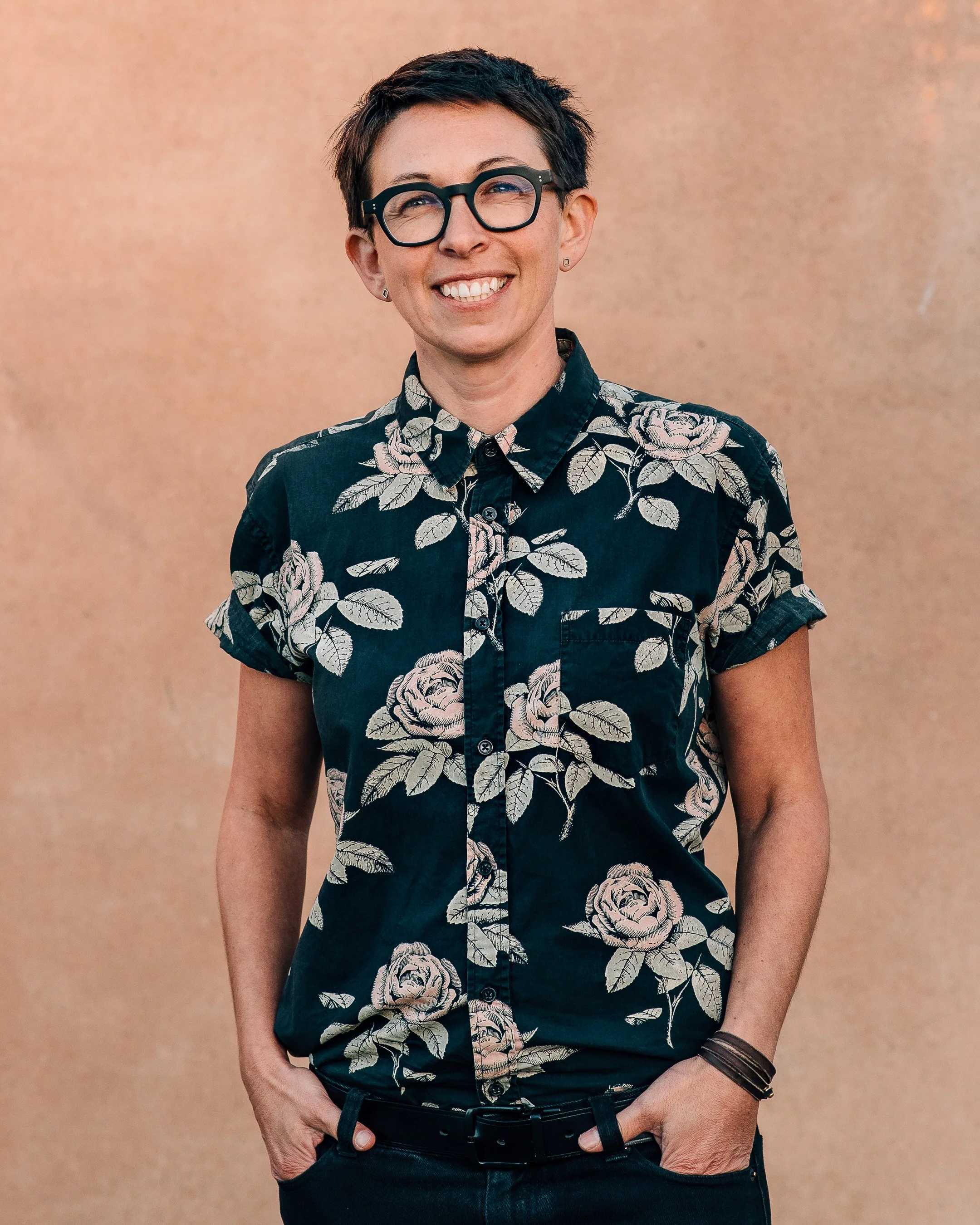 Professional business profile photo taken outdoors against a neutral background in the Adelaide CBD.