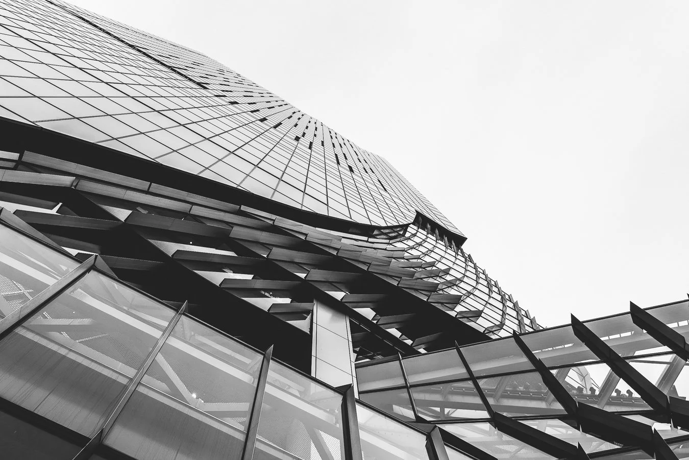 Low-angle monochrome shot showcasing modern commercial architectural design.