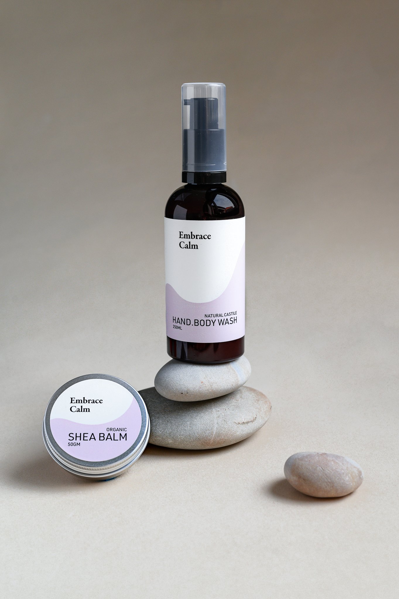 Custom label design and studio product photography for 'Embrace Calm' natural shea balm and body wash.