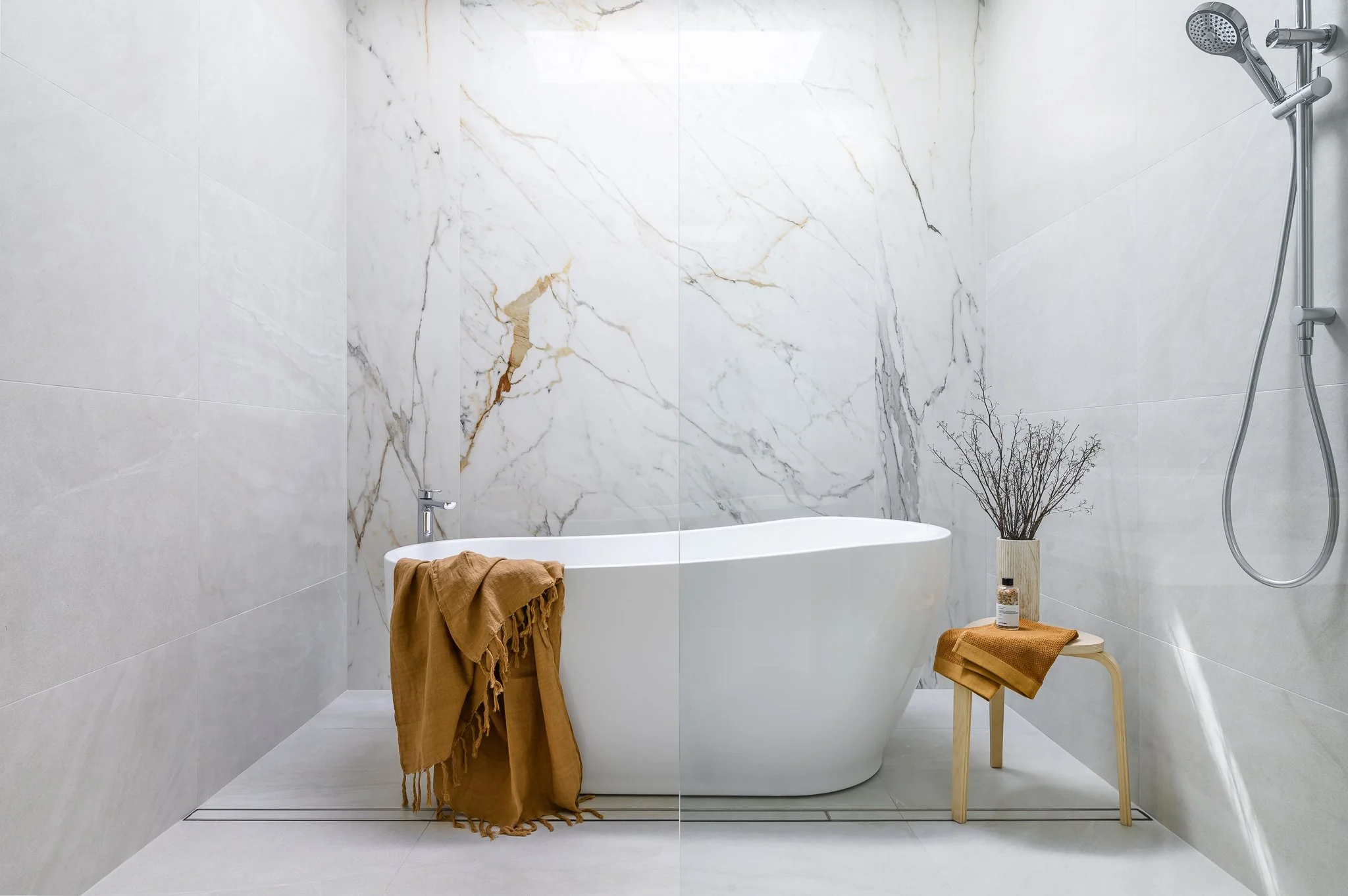 Adelaide interior photography of a modern bathroom featuring a freestanding bathtub, marble finishes and refined contemporary design.