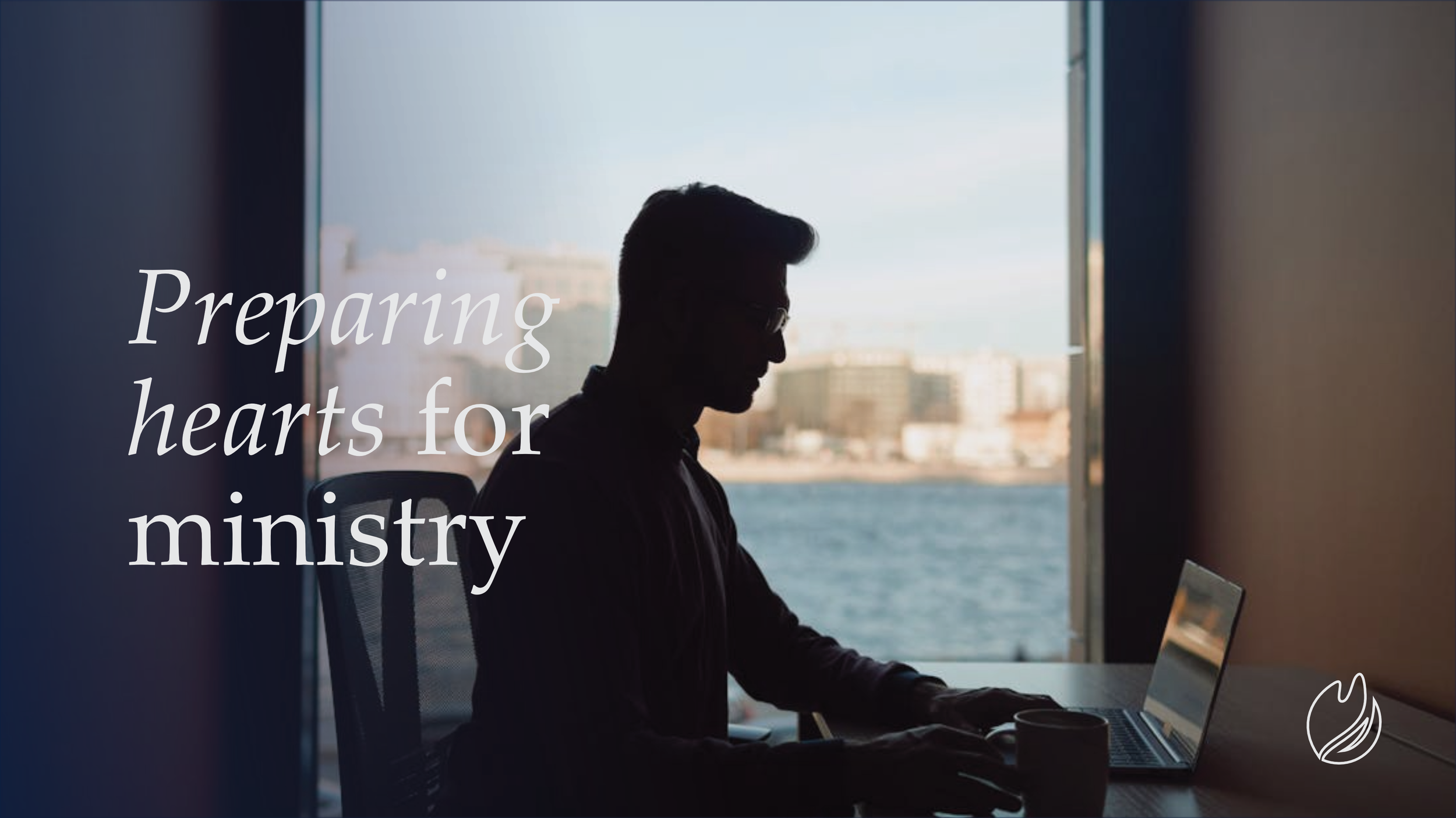Silhouette of a man working on a laptop at a desk in front of a large window overlooking a body of water and cityscape. Overlaid text says 'Preparing hearts for ministry.'
