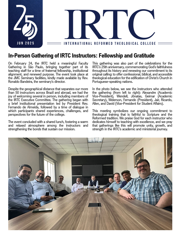 Group of nine men seated around a conference table during an in-person gathering of IRTC instructors for fellowship and gratitude, with presentation screens behind them.