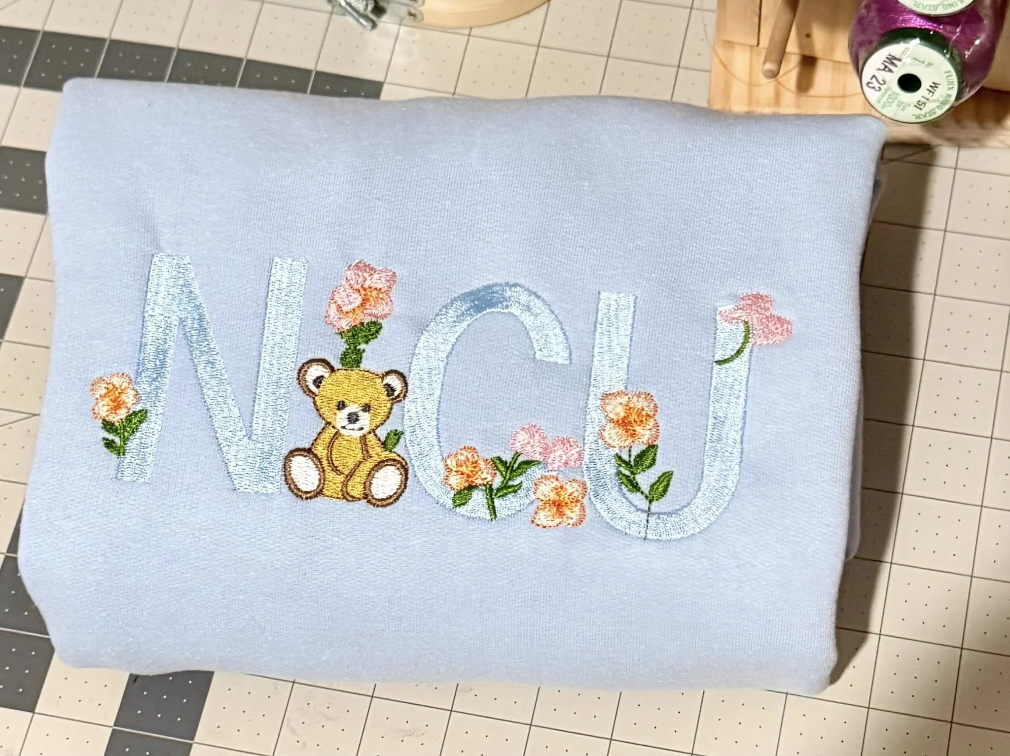 NICU light blue sweatshirt close up.jpg