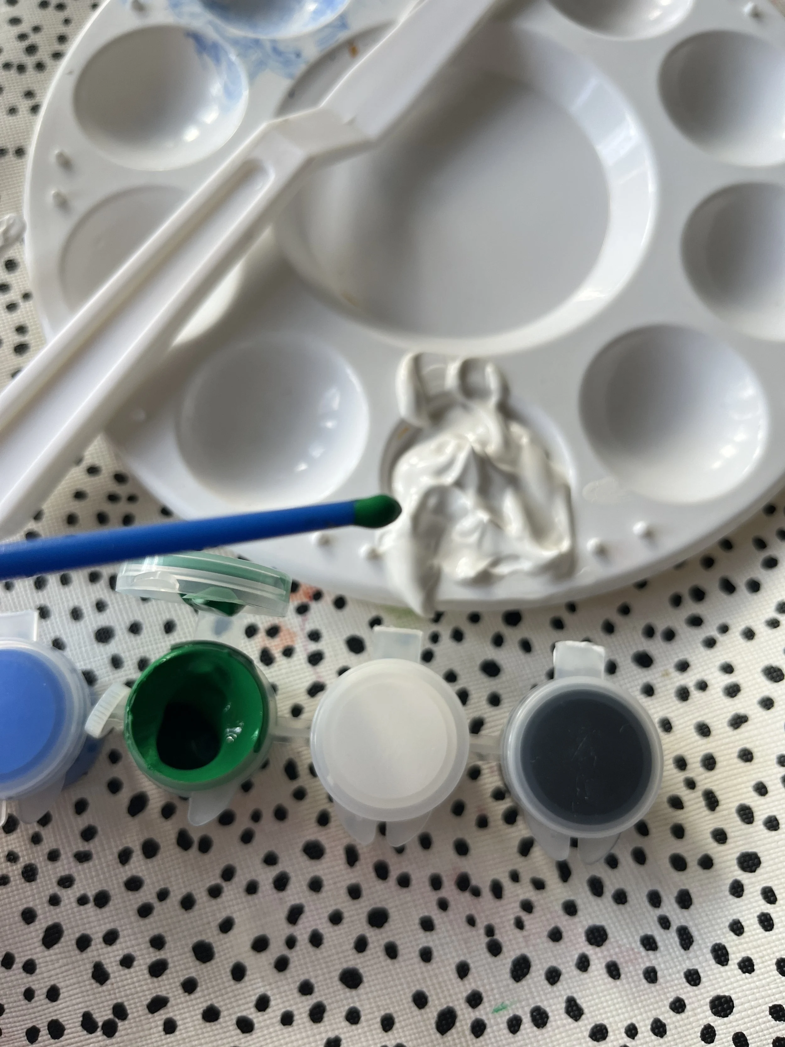 3. Think about what colours you might like to make, we choose to do 3 colours but you could make some up to match your interiors. You only need a little dab of paint so use the end of the paintbrush to add to the paste and mix together. You can alway
