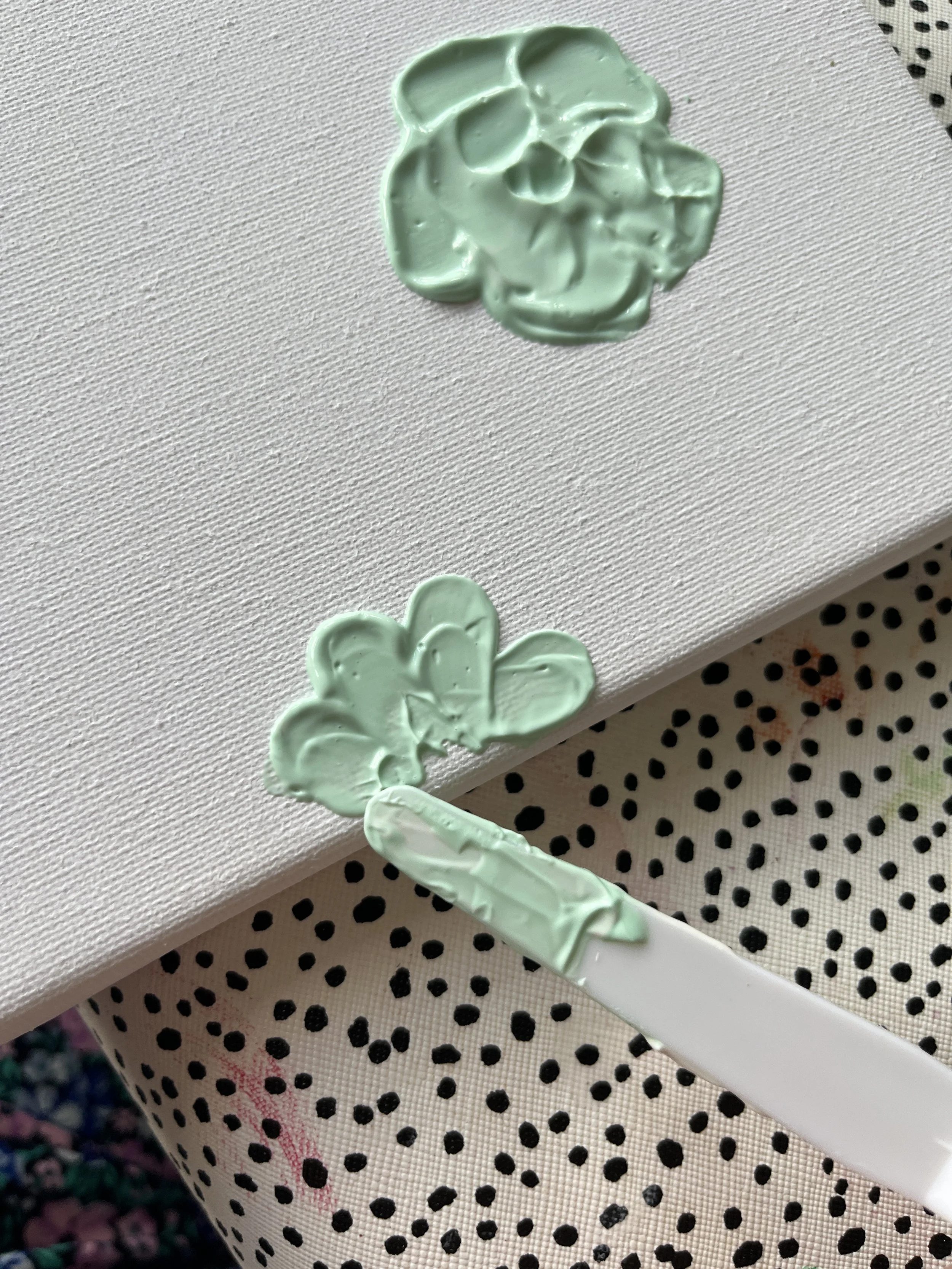 19. Use the long, rounded knife to create daisy/ dahlia style florals, you can even have some coming off the canvas like here. 