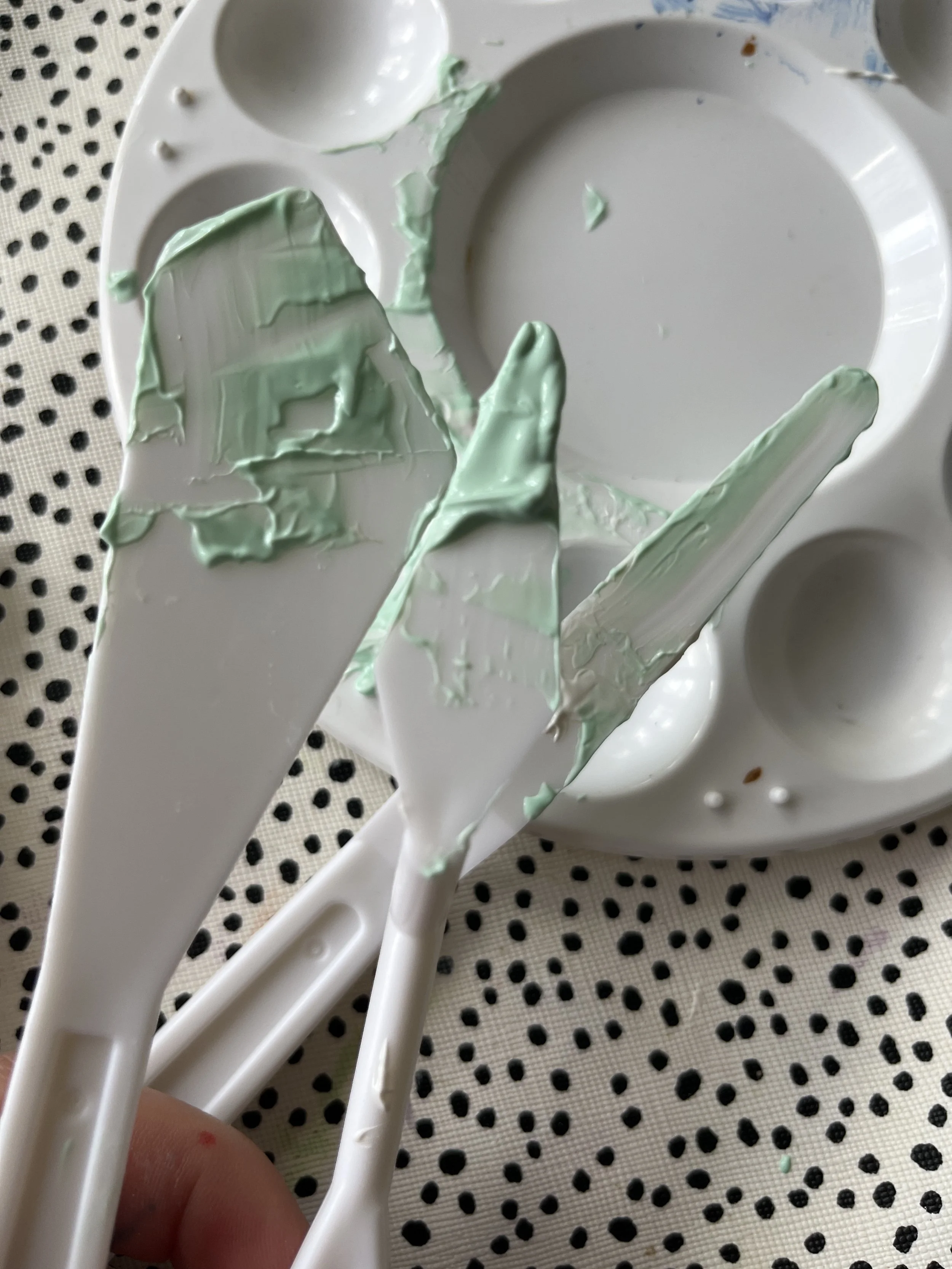 20. You can use your other tools to scrape the remaining paste from the palette onto the tool you want to use. You may want to do a few flowers and leaves dotted across the canvas before adding a new colour. 