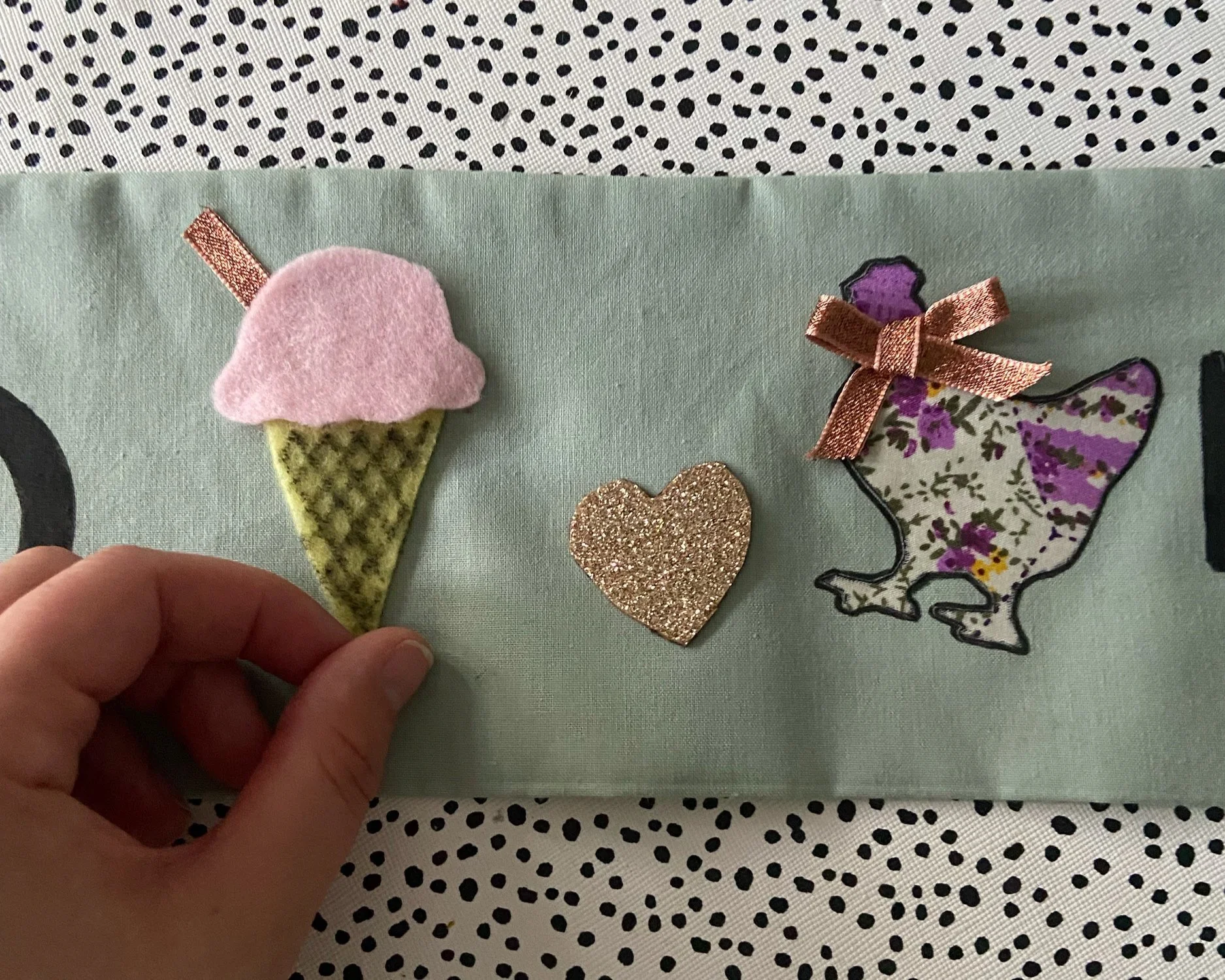 Here I have used a mixture of felt, fabric, the black fabric pen and some of the ribbon to create the little bow for the hen and flake for the ice cream! 