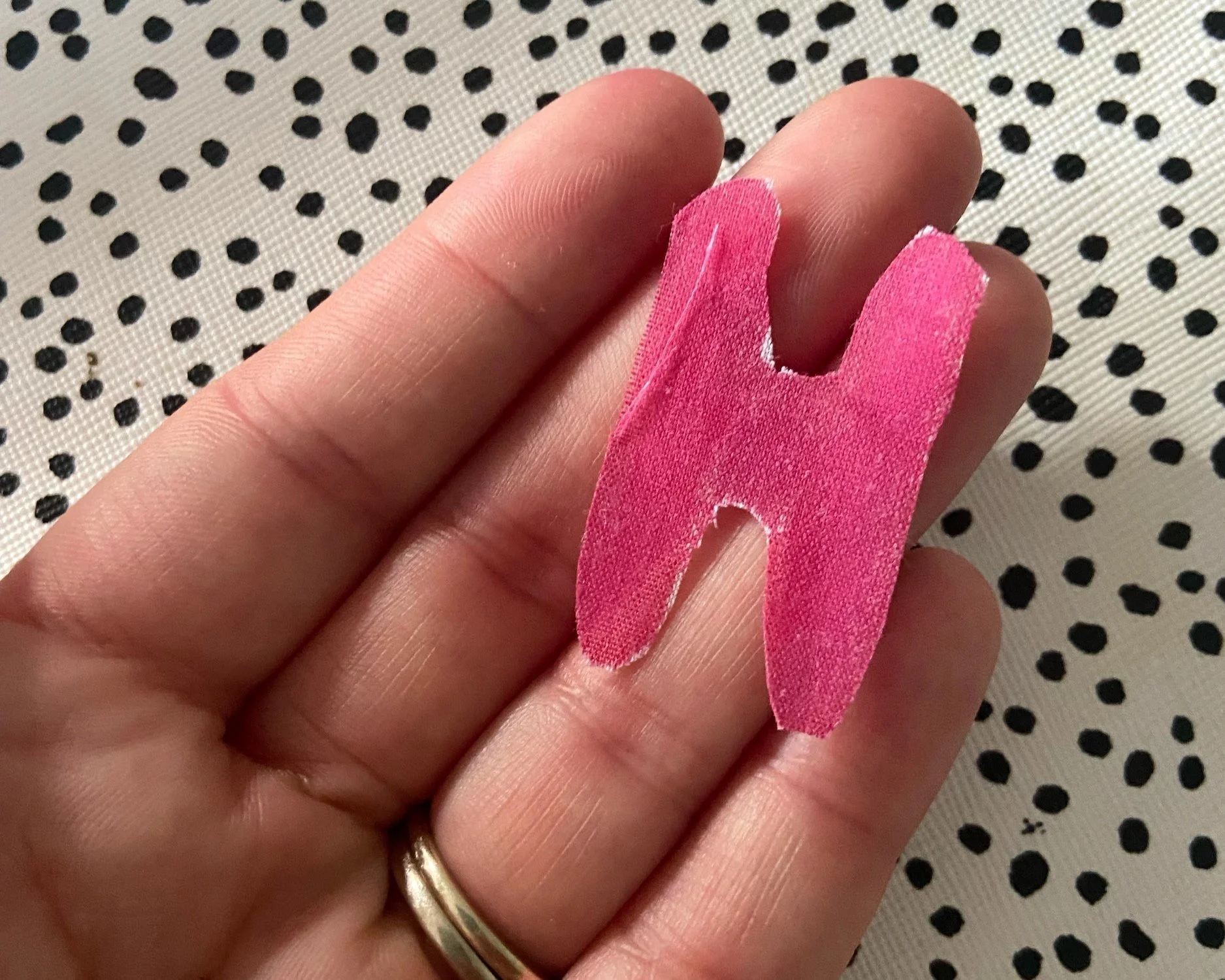 Alternatively, you can cut the letters or shapes out individually and then attach them to the sash using the fabric glue. 