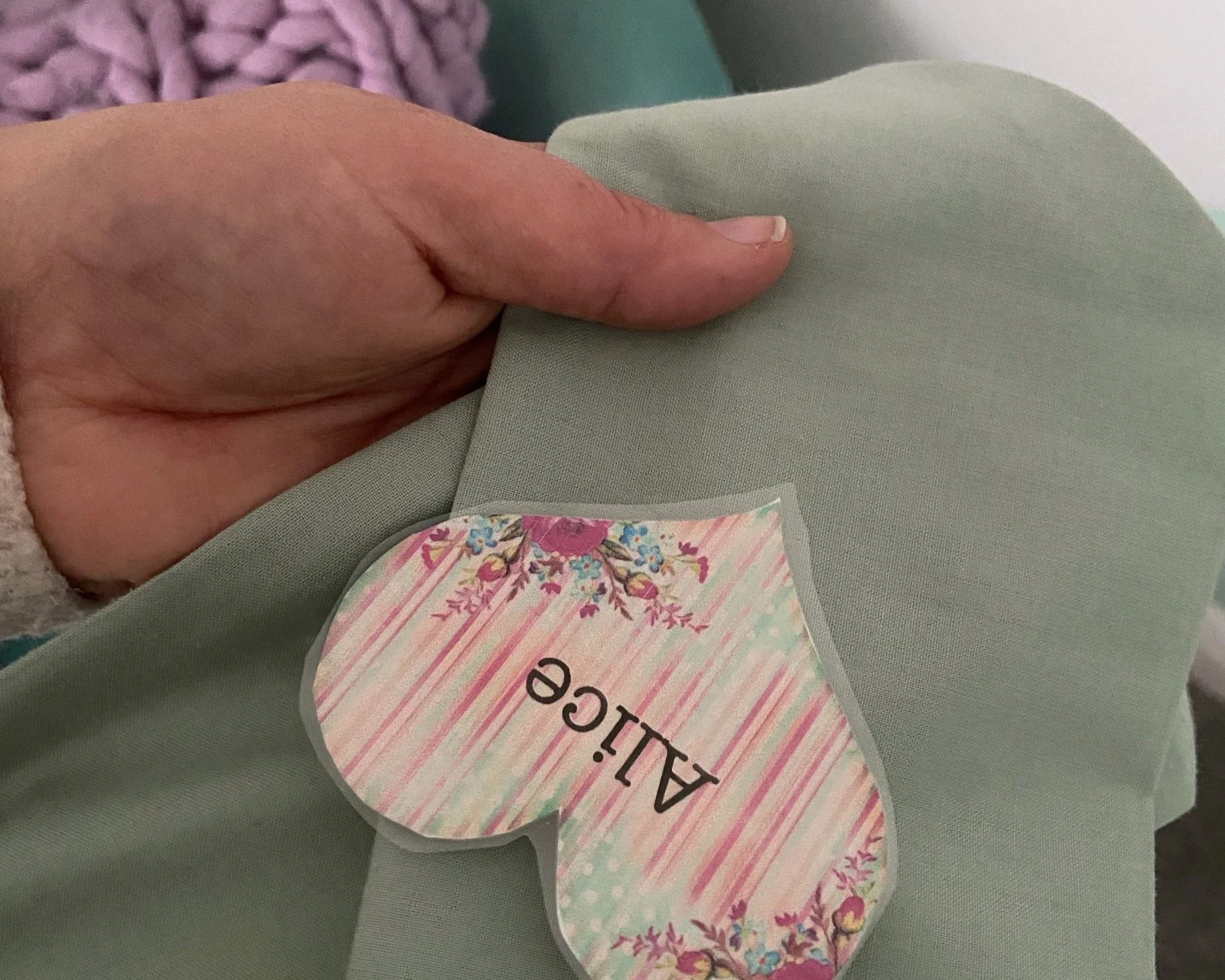 Once you are happy with your finished sash, use your name badge to pin both sash pieces together where feels comfortable and you are done! 